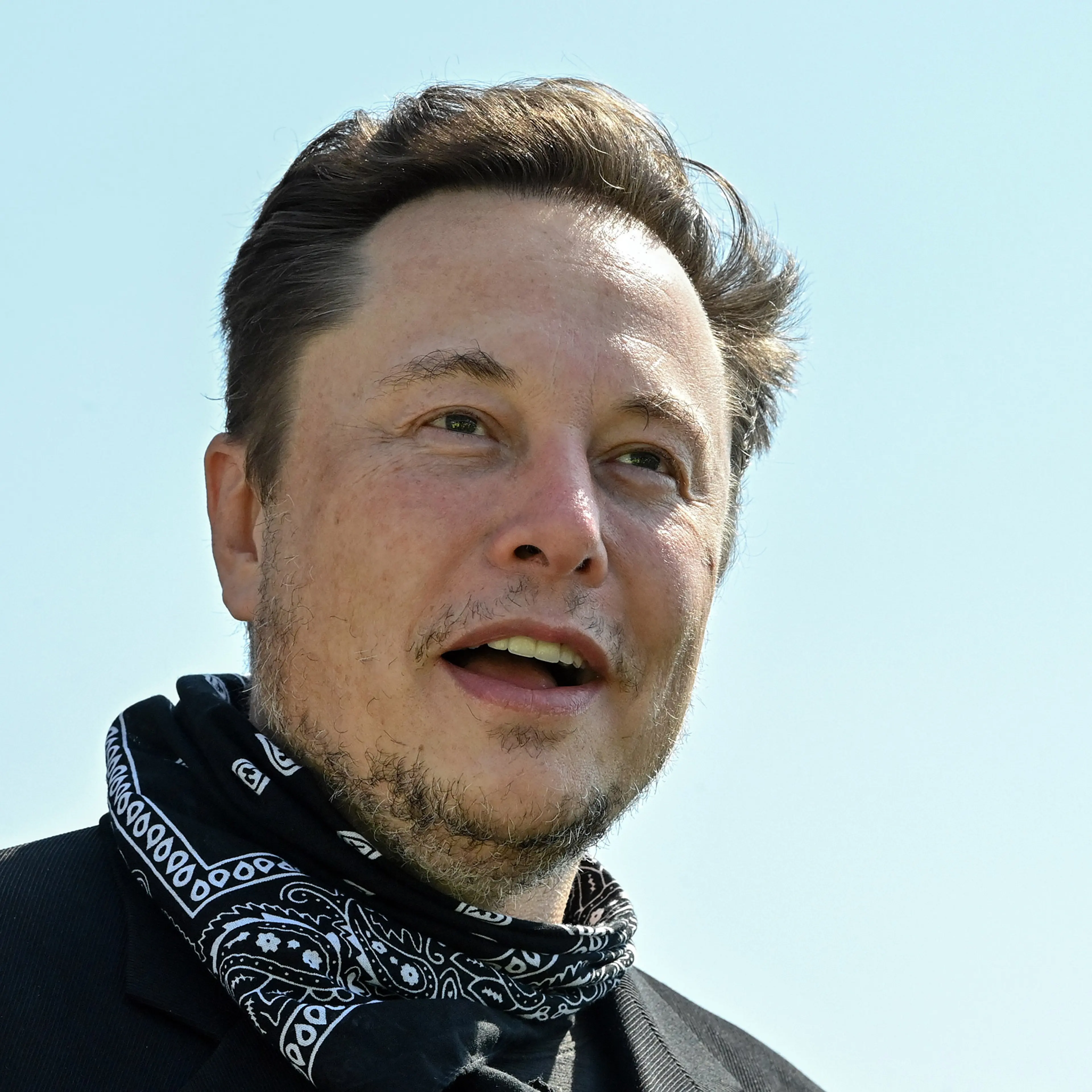 Elon Musk speaks to press outside the Tesla Gigafactory in Grünheide, Germany in August 2021.