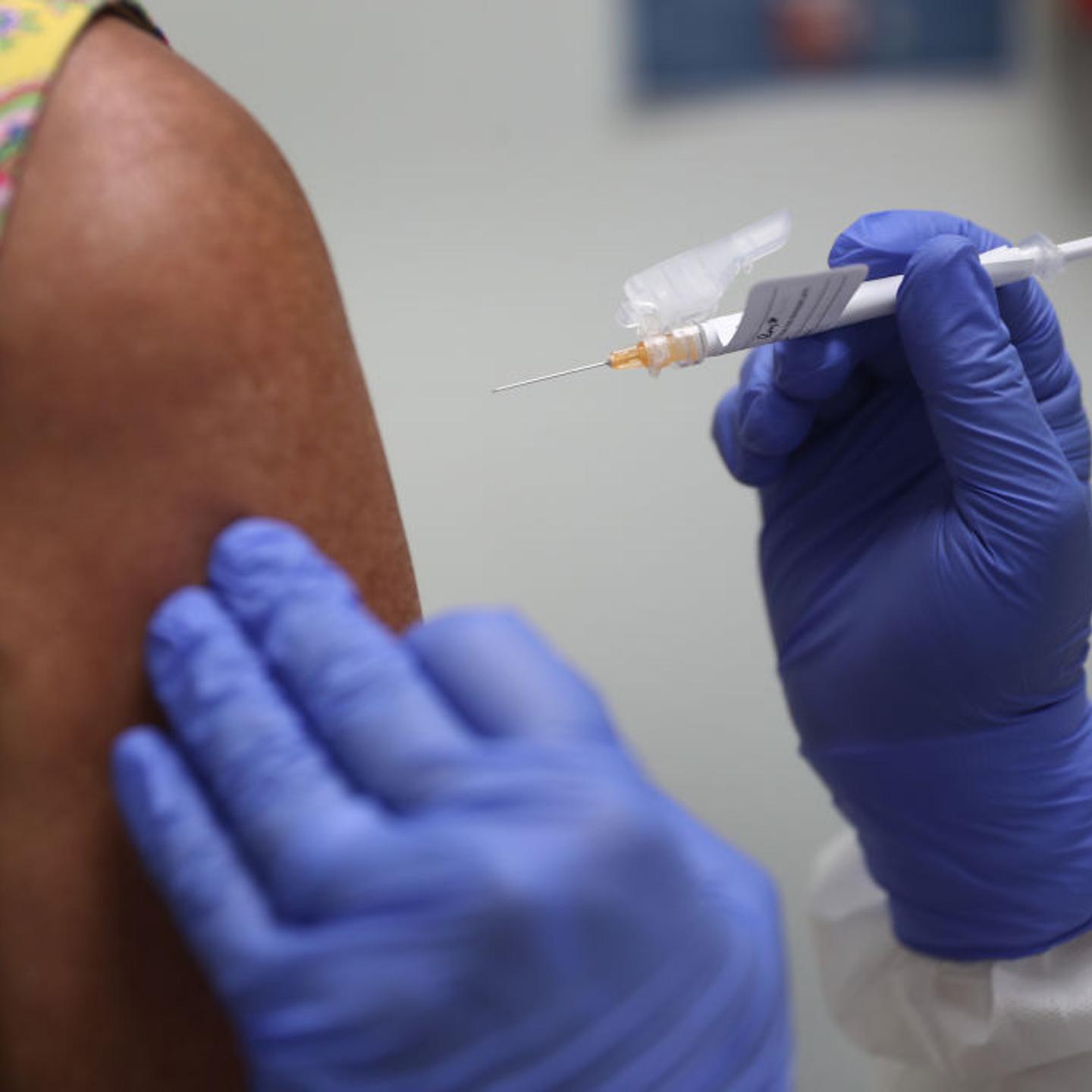 Lisa Taylor receives a COVID-19 vaccination from RN Jose Muniz as she takes part in a vaccine study at Research Centers of America on August 07, 2020 in Hollywood, Florida