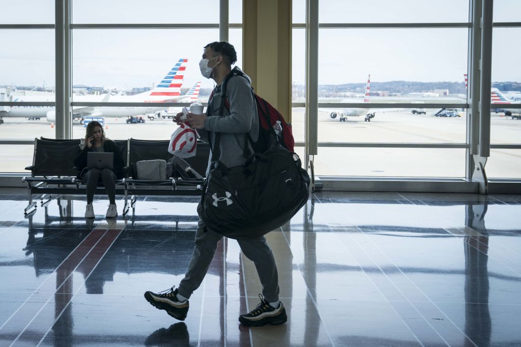 Travelers At Reagan Airport As Coronavirus Outbreak Continues To Spread