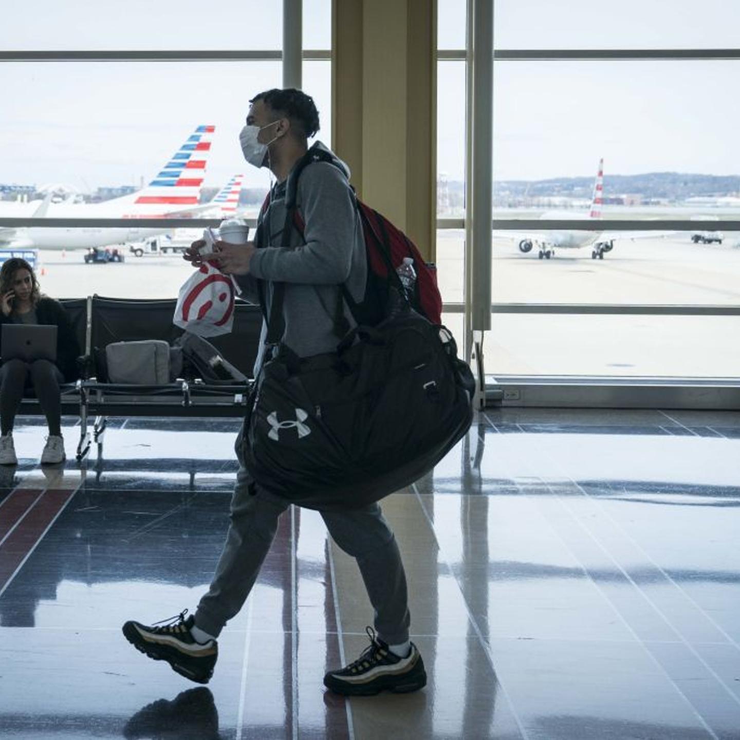 Travelers At Reagan Airport As Coronavirus Outbreak Continues To Spread