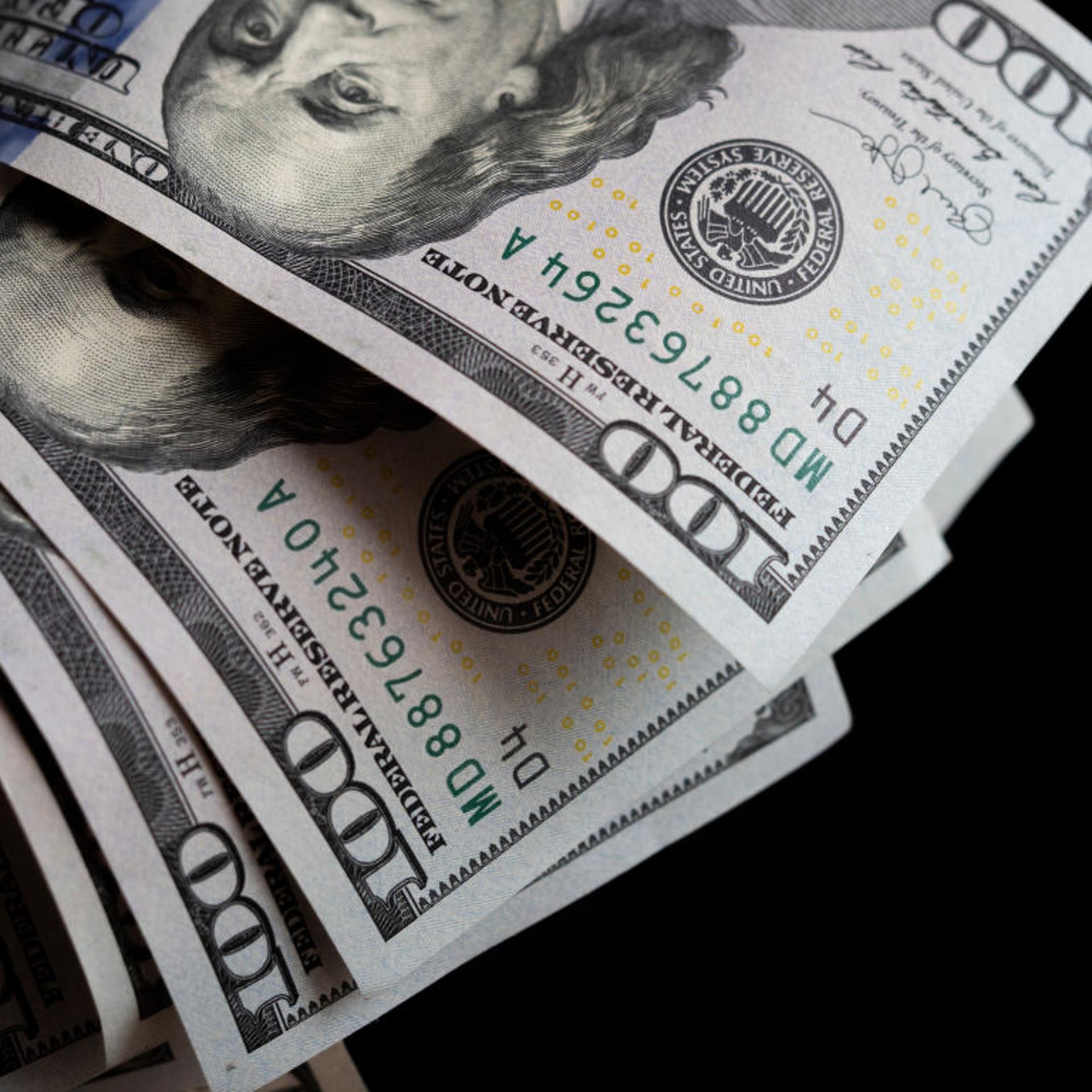 A photo illustration of US 100 dollar bills