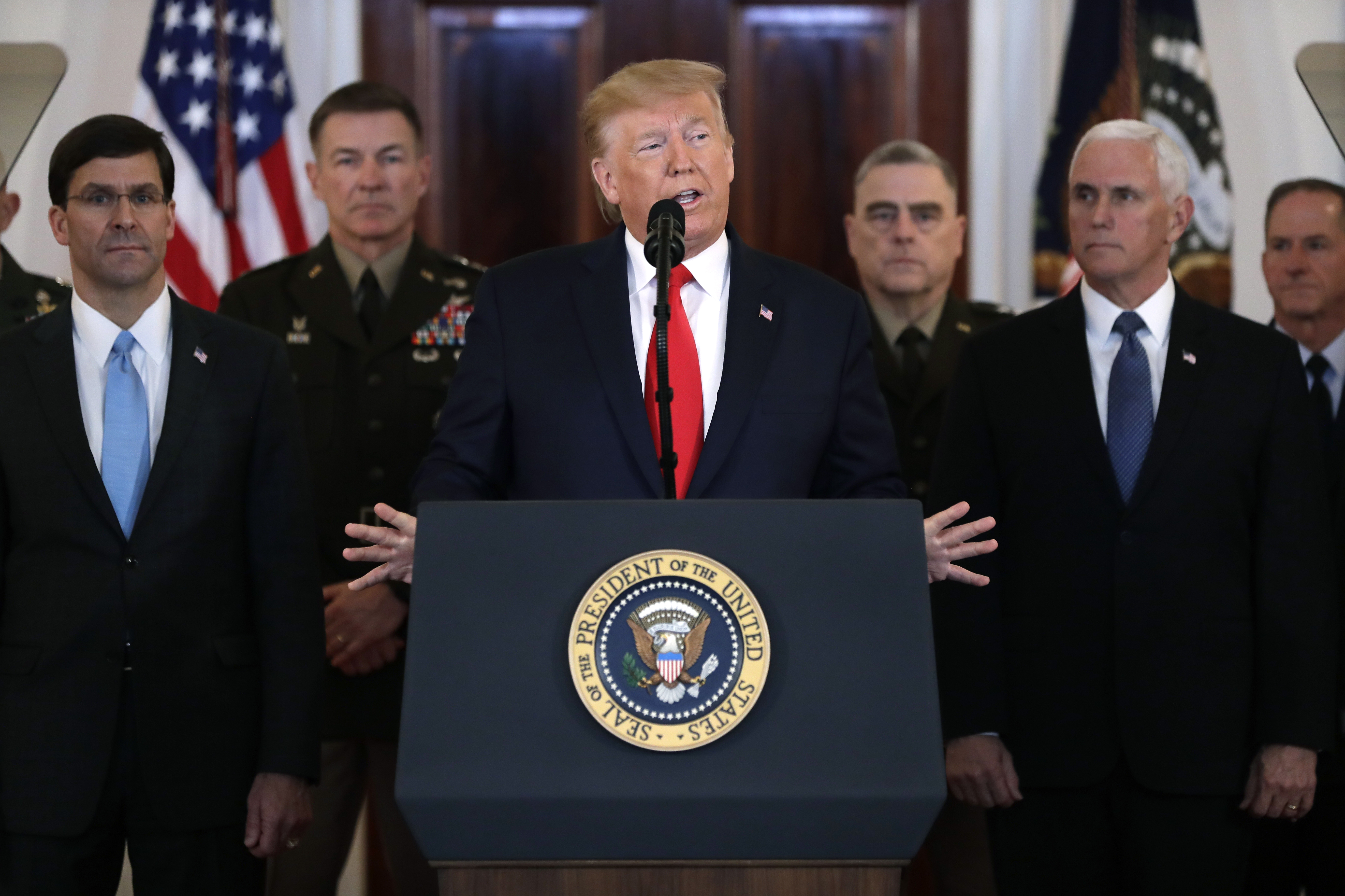 Donald Trump speaks in front of podium