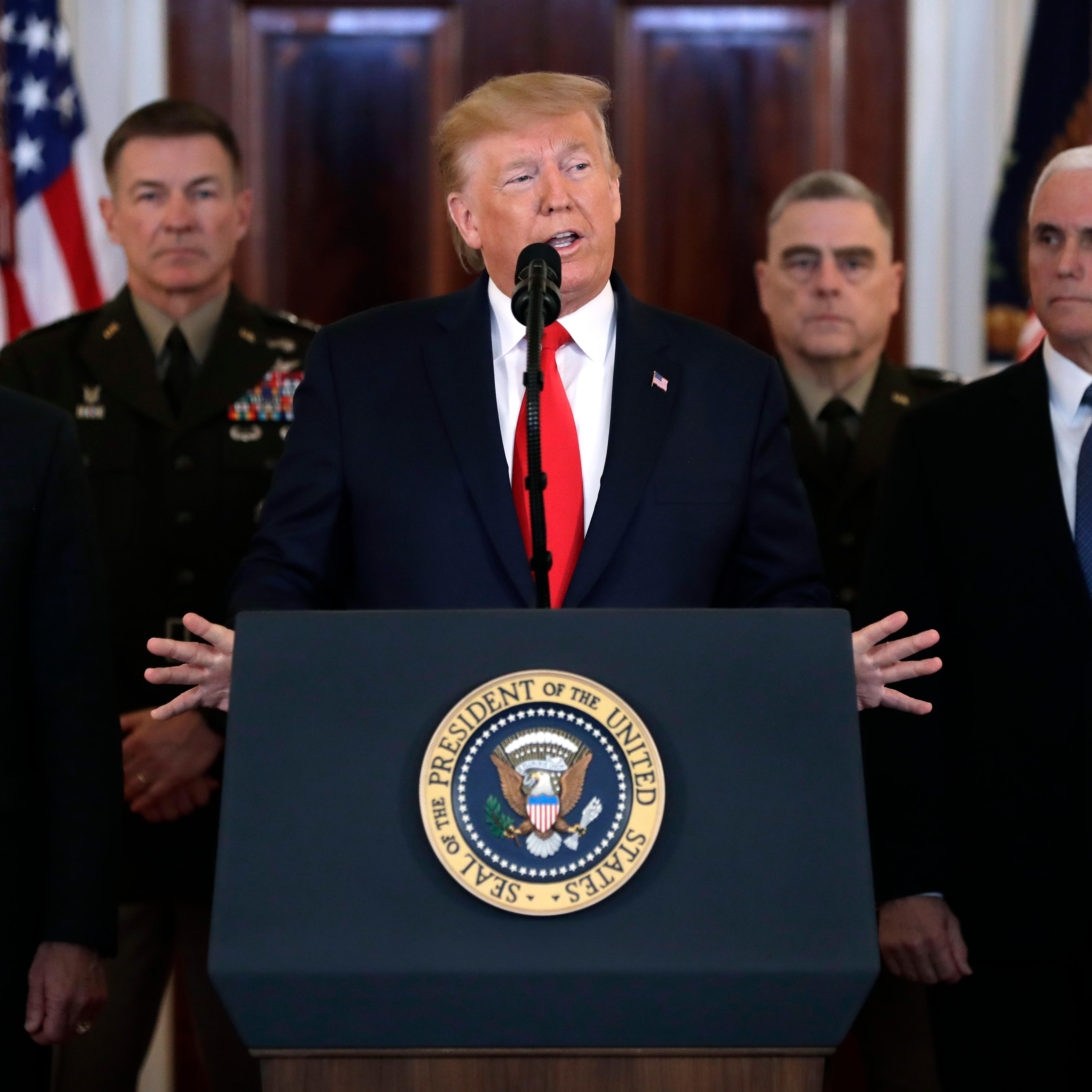 Donald Trump speaks in front of podium