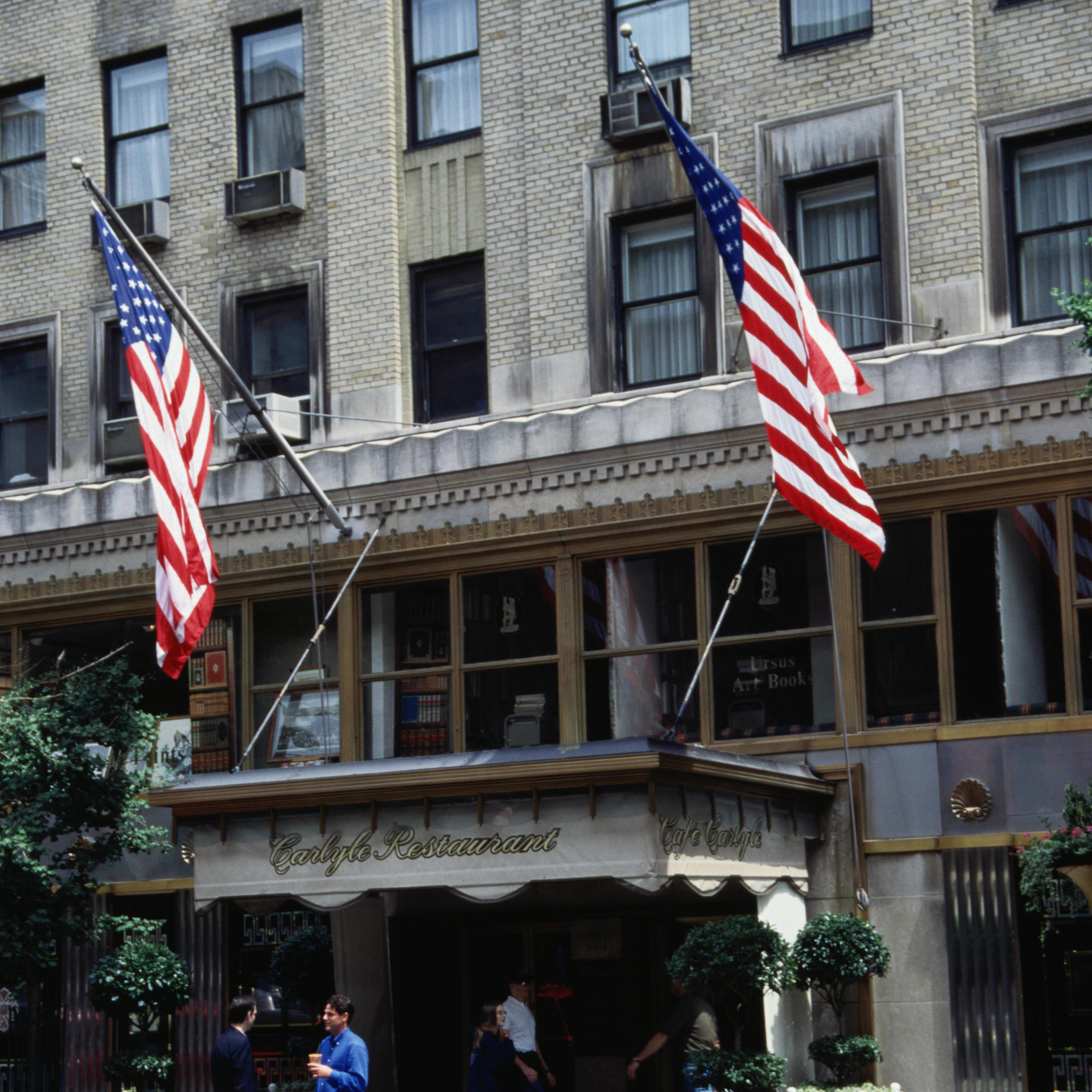 People standing in front of the Carlyle Hotel.