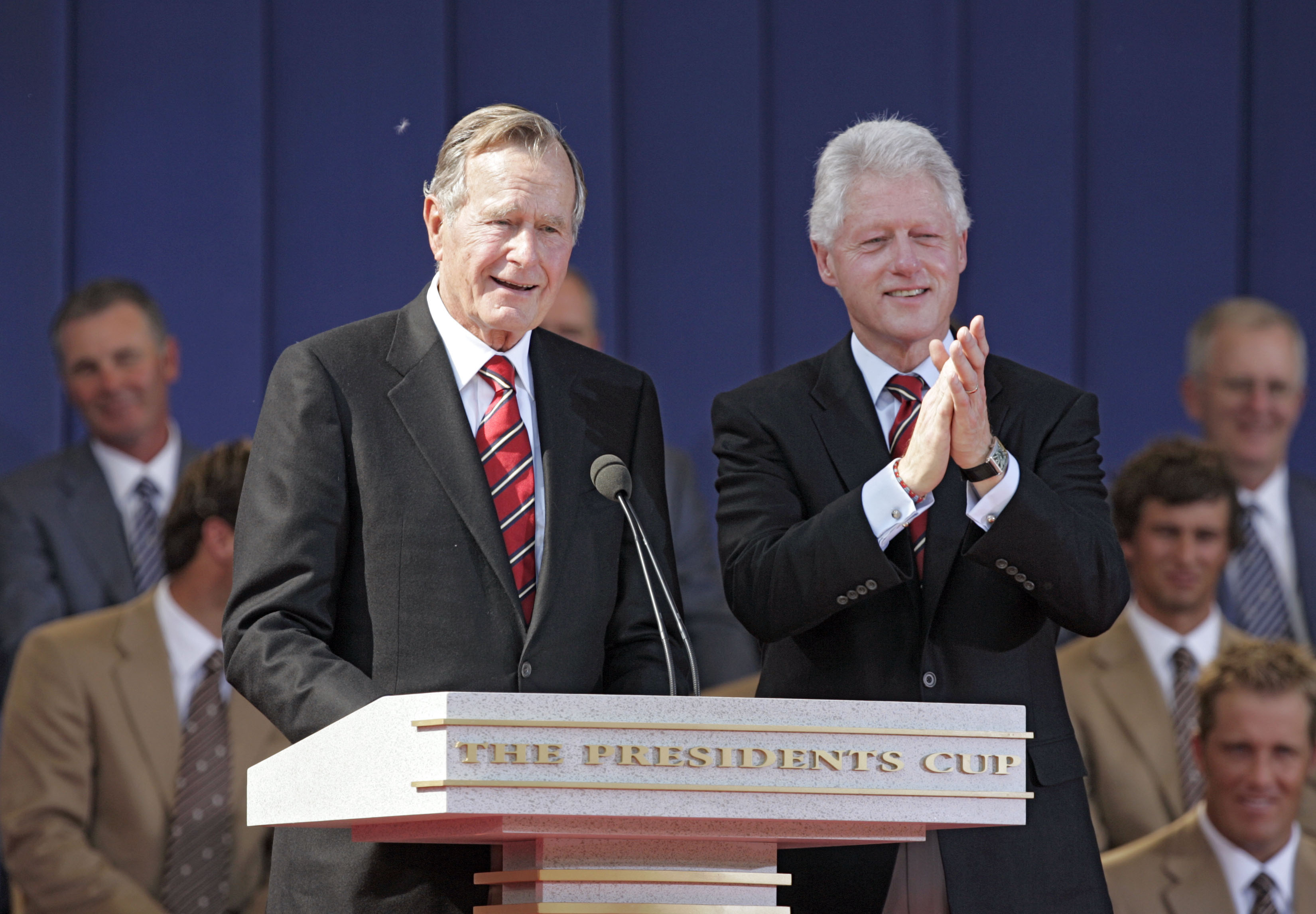 Former Presidents George H.W. Bush and Bill Clinton during the opening ceremony of The Presidents Cup at Robert Trent Jones Golf Club in Prince William County, Virginia on Sept. 22, 2005.