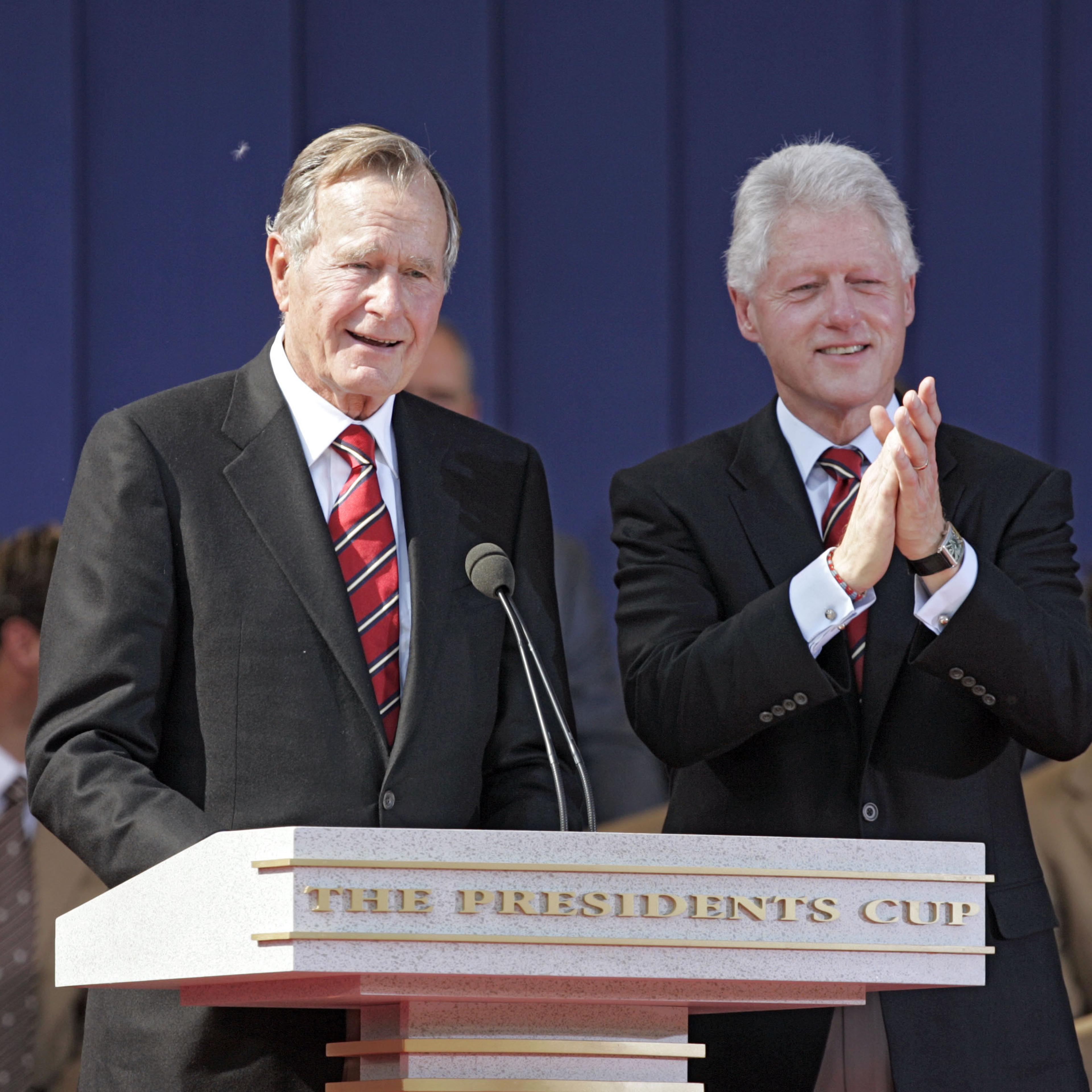 Former Presidents George H.W. Bush and Bill Clinton during the opening ceremony of The Presidents Cup at Robert Trent Jones Golf Club in Prince William County, Virginia on Sept. 22, 2005.