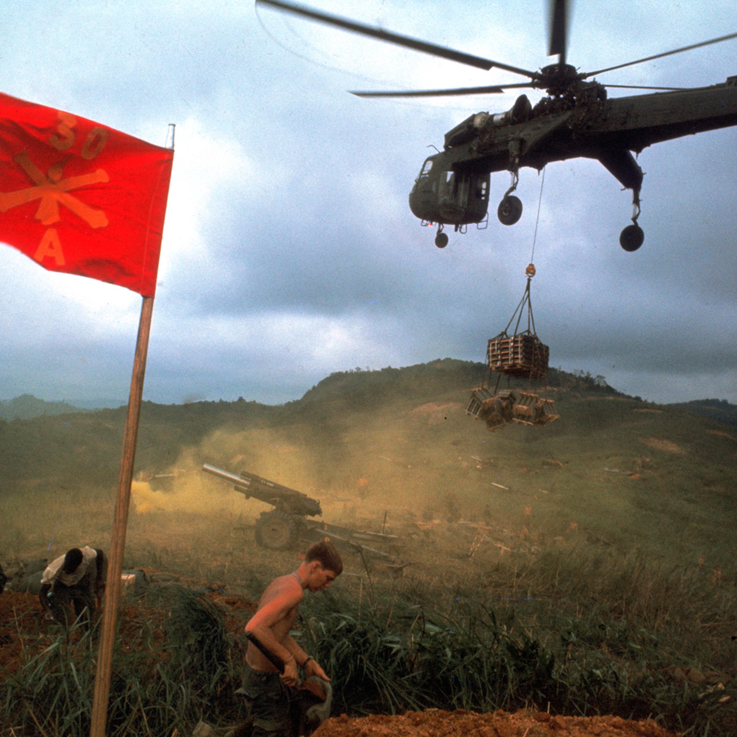 An American 1st Air Cavalry helicopter airlifts supplies into a Marine outpost during Operation Pegasus, Vietnam, spring 1968.