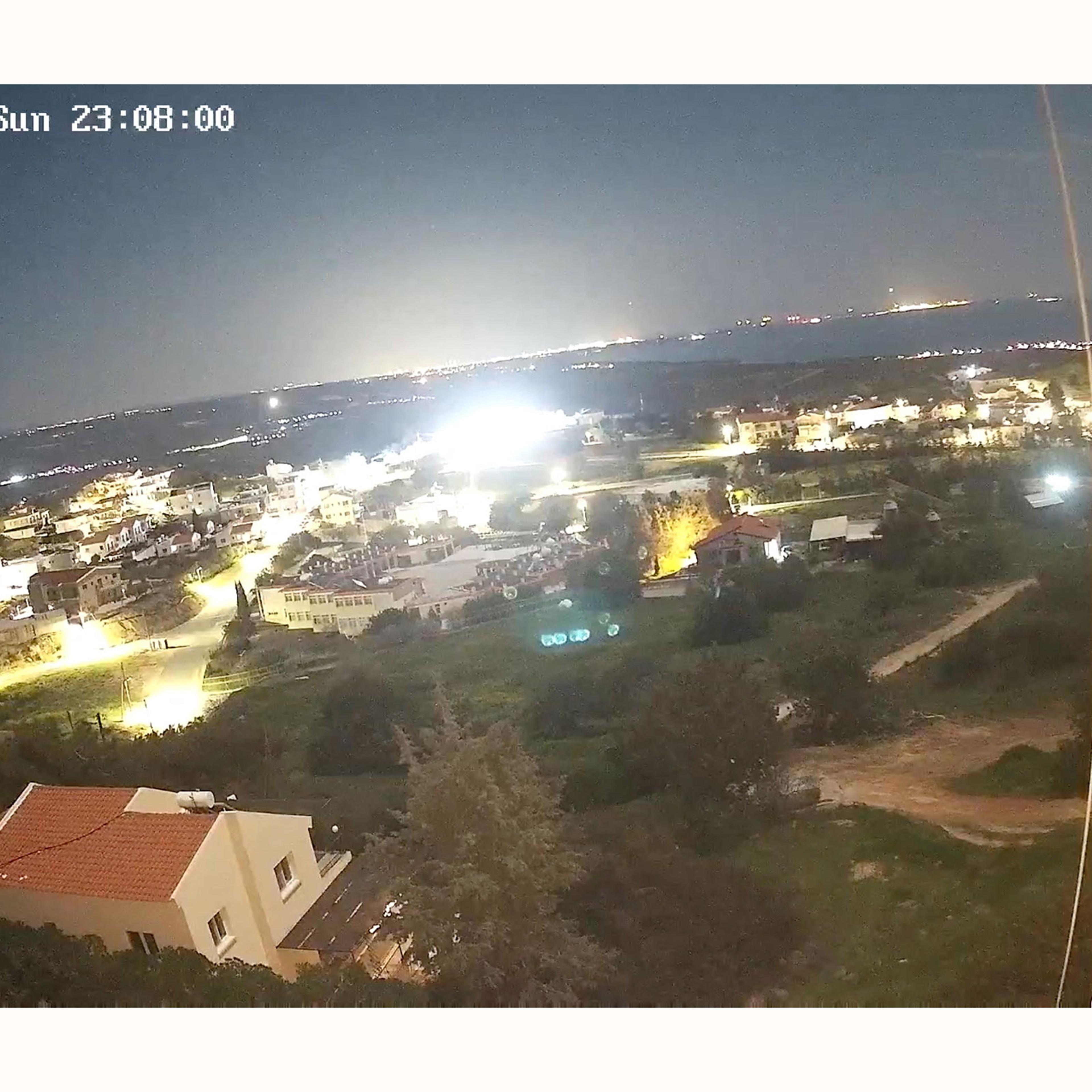 Flashes appear in the sky appear over RAF Akrotiri, as seen from Pissouri