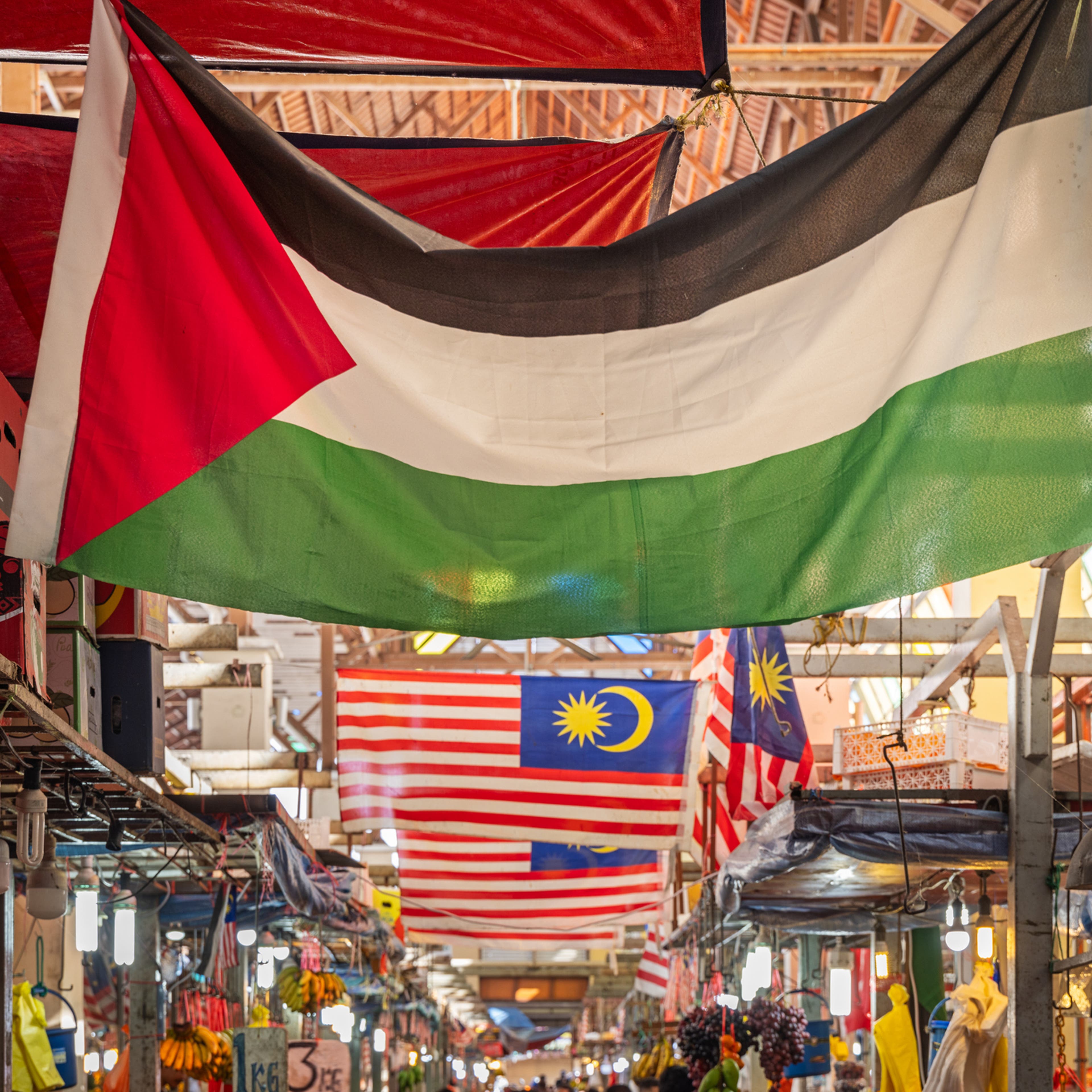 Palestinian flag under the roof in a market hall