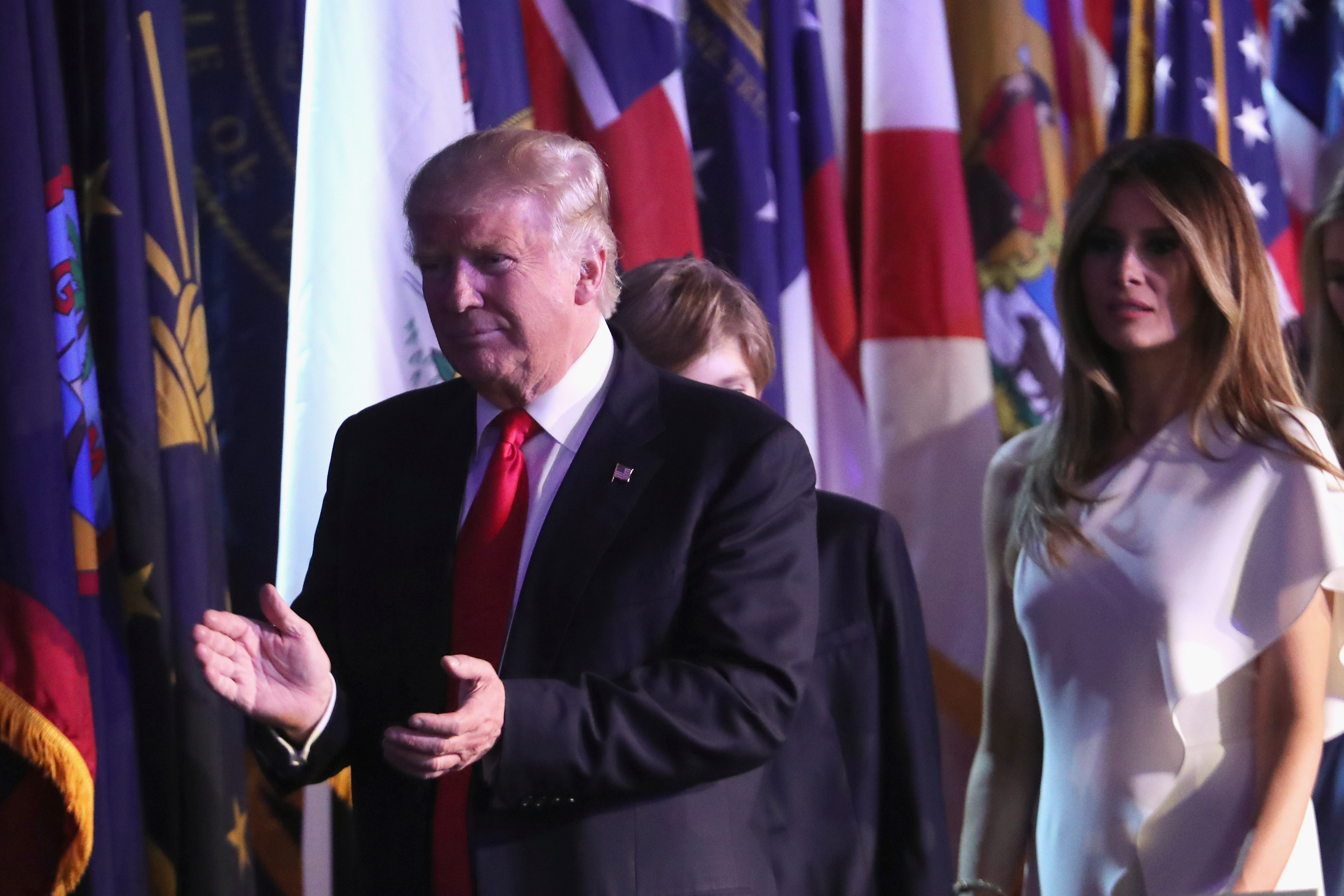 Republican president-elect Donald Trump walks on stage along with his son Barron Trump (C) and his wife Melania Trump to deliver his acceptance speech at the New York Hilton Midtown in the early morning hours of Nov. 9, 2016.
