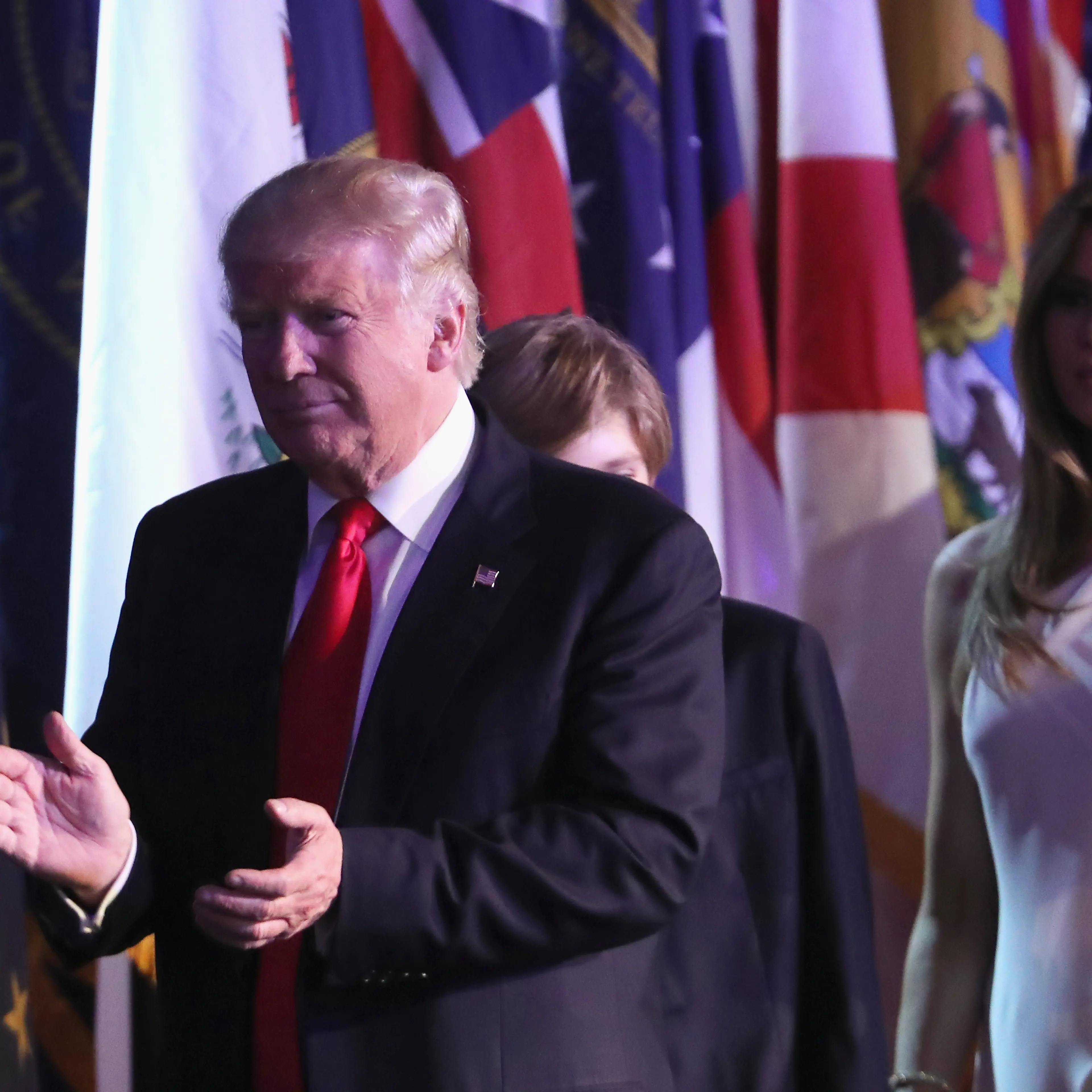 Republican president-elect Donald Trump walks on stage along with his son Barron Trump (C) and his wife Melania Trump to deliver his acceptance speech at the New York Hilton Midtown in the early morning hours of Nov. 9, 2016.