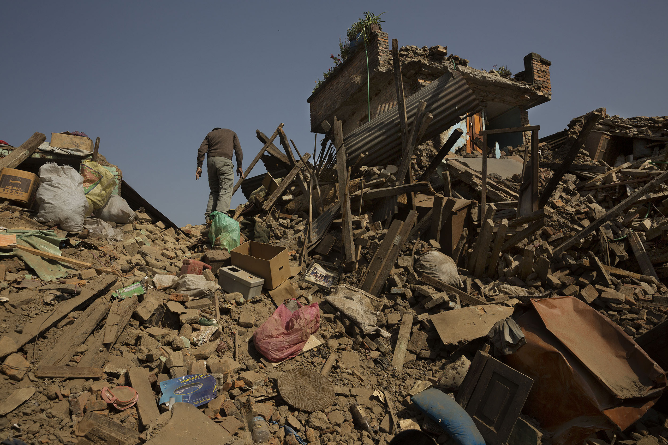 Nepal earthquake. Town of Sankhu. Mush of town was destroyed. People digging out their possessions. Aerial images of Nuwakot district, hit by the earthquake and not able to be reached by aid and rescue teams. Farming villages built atop steep hillsides w