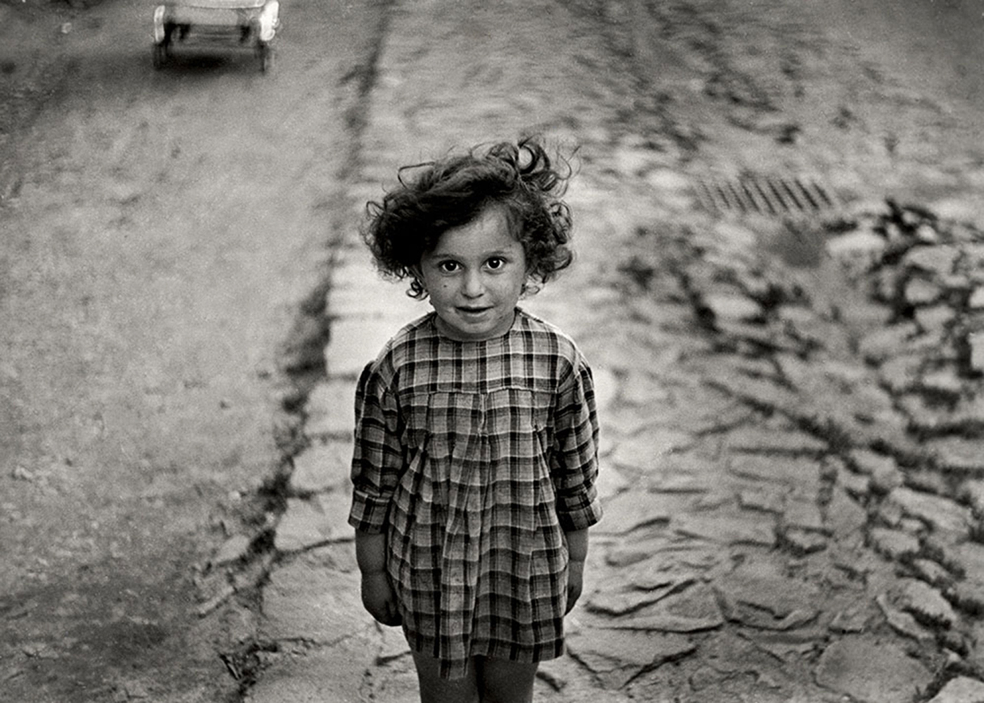 Girl in plaid dress, Mukacevo, Ukraine ca. 1935–38.