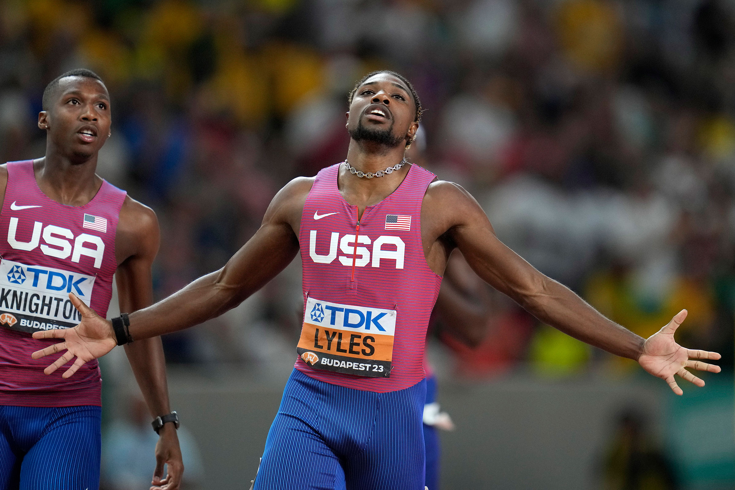 Noah Lyles, of the United States, celebrates after winning the Men's 200-meters final followed by Erriyon Knighton, of the United States in second during the World Athletics Championships in Budapest, Hungary, on Aug. 25, 2023.