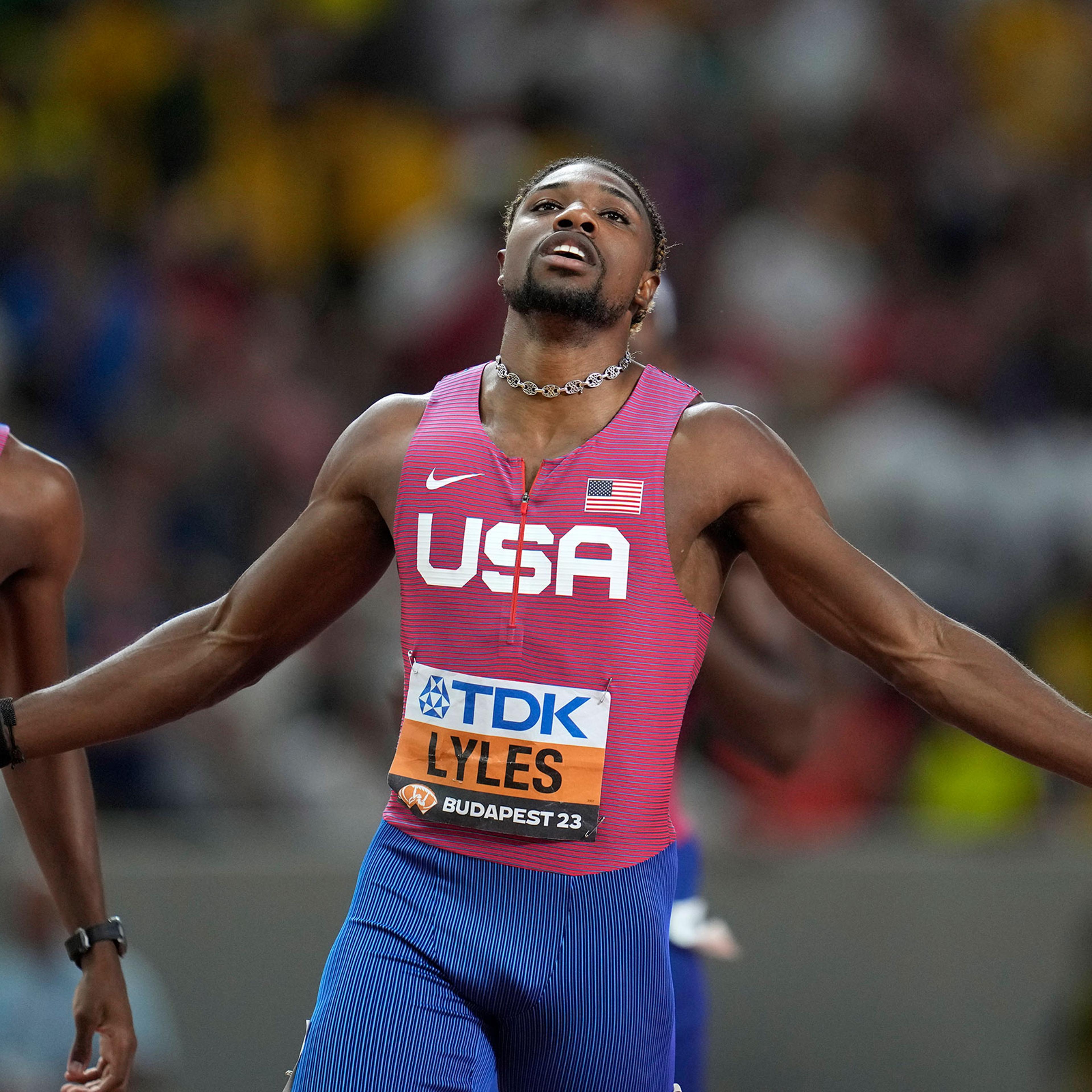 Noah Lyles, of the United States, celebrates after winning the Men's 200-meters final followed by Erriyon Knighton, of the United States in second during the World Athletics Championships in Budapest, Hungary, on Aug. 25, 2023.