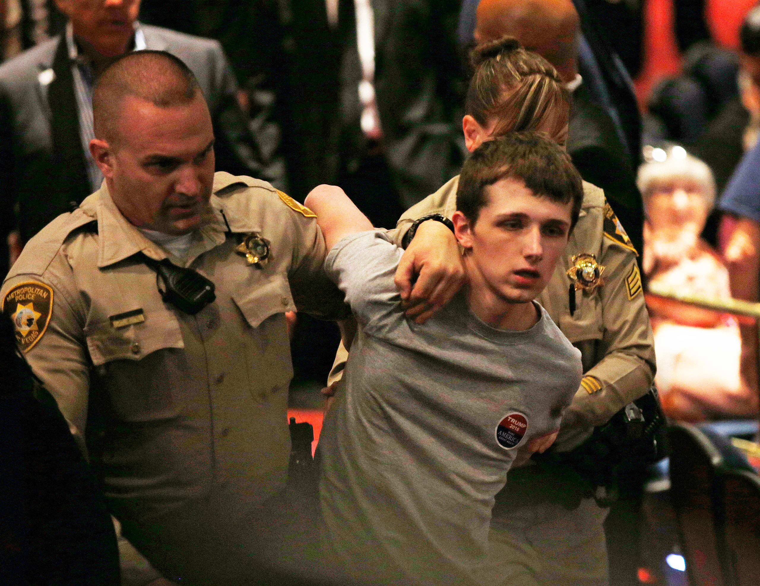 FILE - In this June 18, 2016, photo, police remove Michael Sandford as Republican presidential candidate Donald Trump speaks at the Treasure Island hotel and casino in Las Vegas. The mother of Standford who is accused of attempting to shoot Donald Trump 