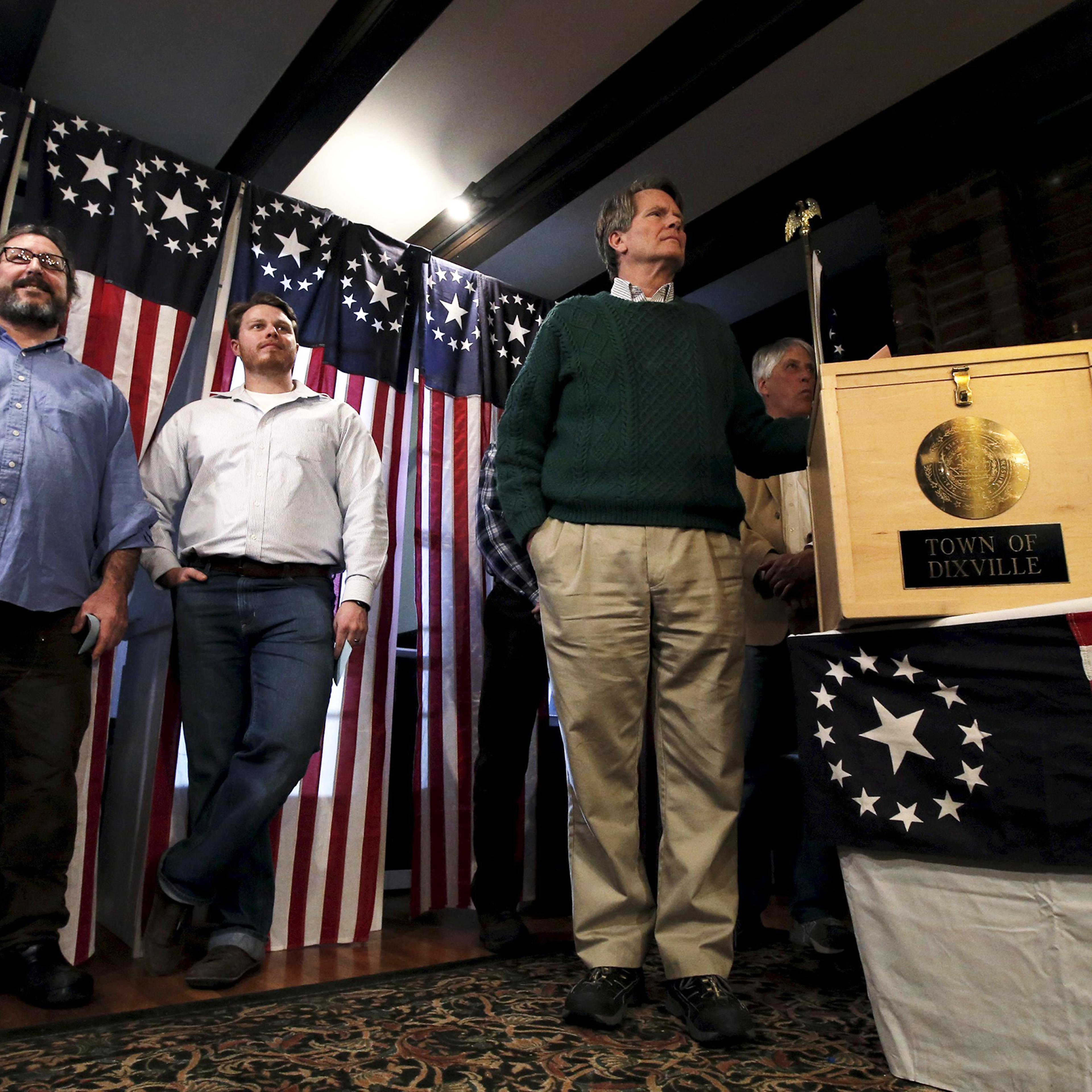 Jeff Stevens and other voters wait for the last few seconds to midnight to cast their votes in the U.S. Presidential primary election at the Hale House at Balsams Hotel in Dixville Notch, NH on Feb. 8, 2016.