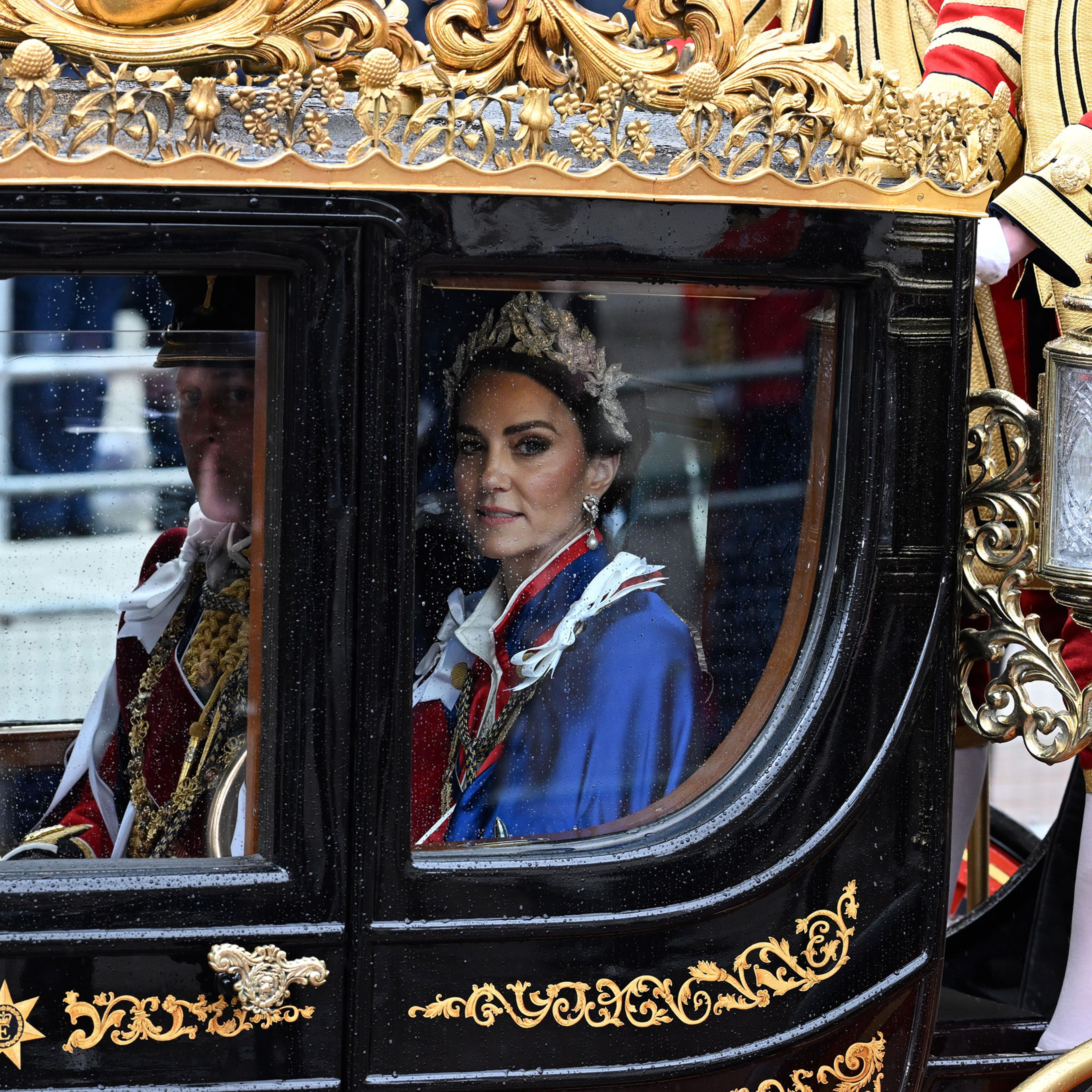 Prince William, Prince of Wales and Catherine, Princess of Wales make their way along the Mall during the Coronation of King Charles III and Queen Camilla in London, on May 6, 2023.