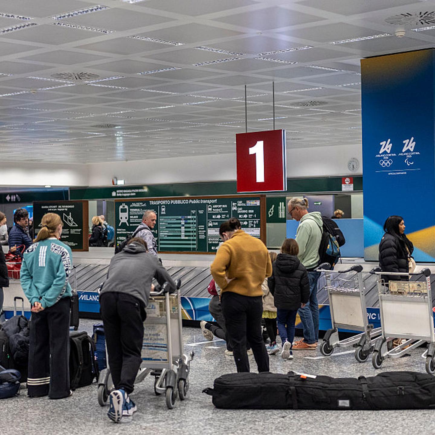 Milano Cortina 2026 Winter Olympics signs are seen in Milano Malpensa Airport in Milan, Italy on Jan. 24, 2026.