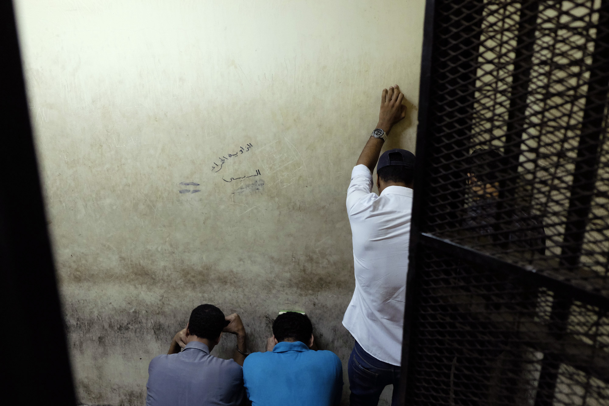 Egyptian men sentenced to life in prison for sexual assaults on women during a number of public rallies in Cairo's iconic Tahrir Square, attend their trial at a court in Cairo, July 16, 2014.