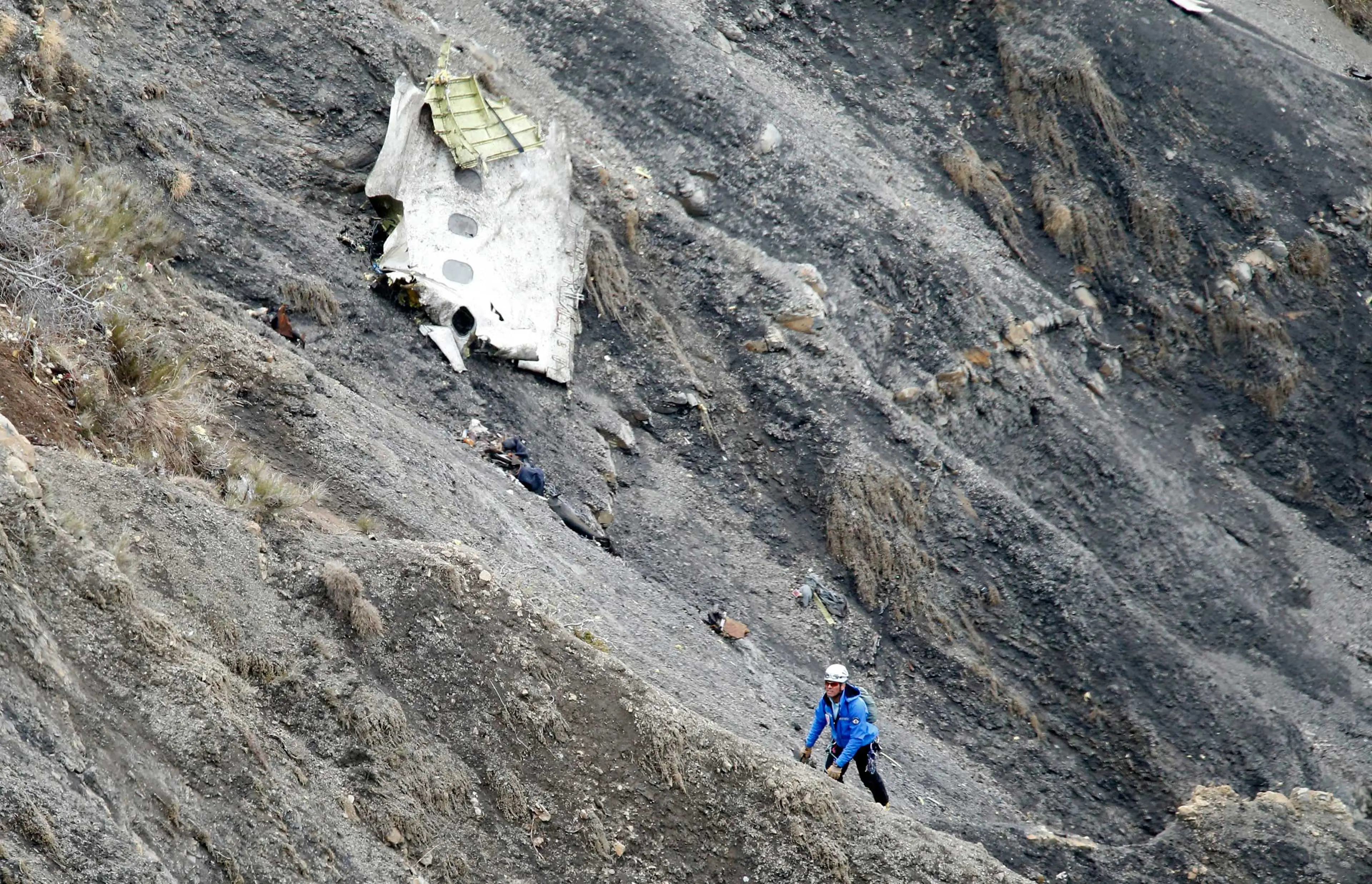 A search and rescue worker at the crash site of the Germanwings Airbus A320 that crashed in the French Alps, above the town of Seyne-les-Alpes, southeastern France, March 25, 2015.