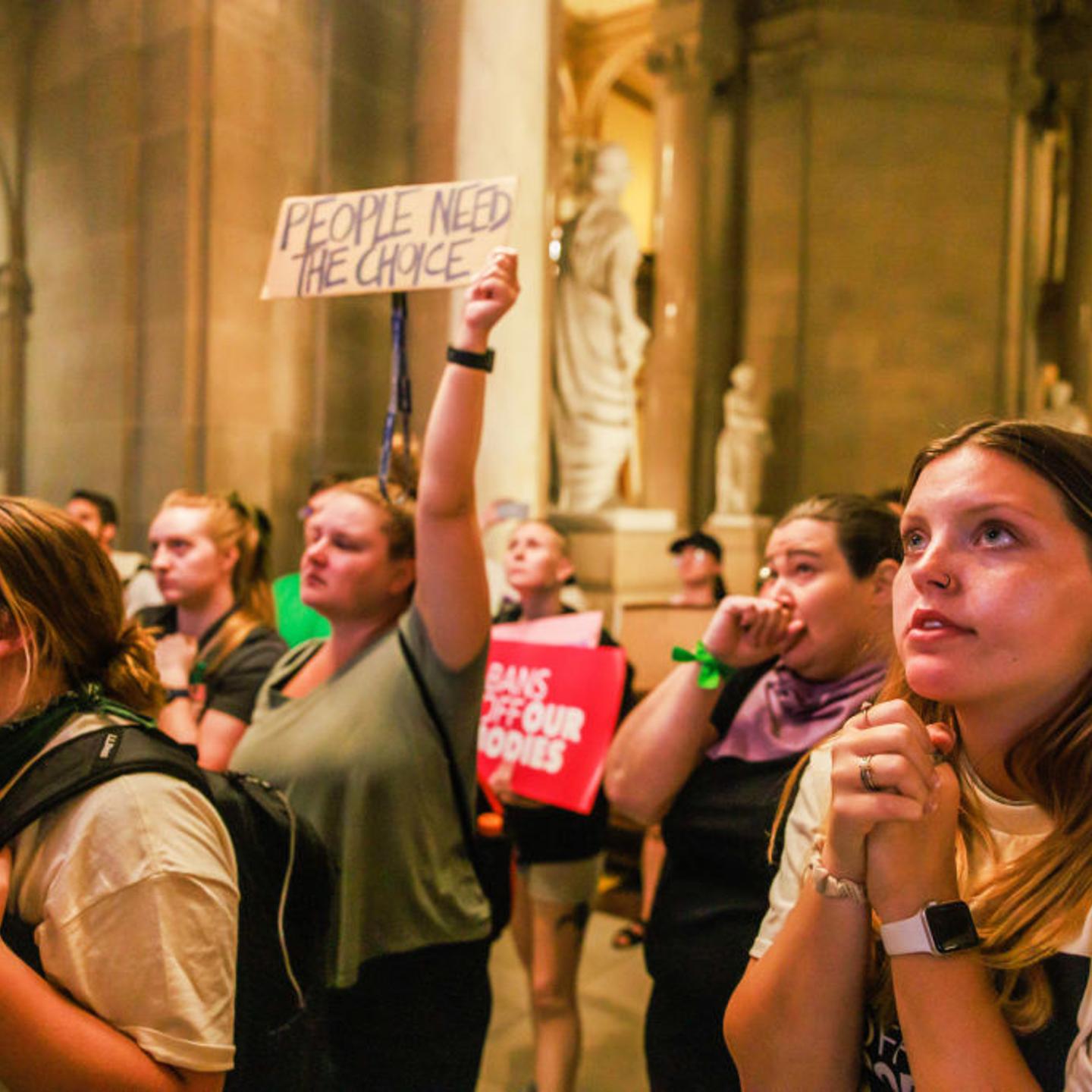 Abortion rights activists react after the Indiana Senate