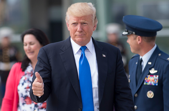US President Donald Trump gives a thumbs-up as he walks to Air Force One prior to departure from Andrews Air Force Base in Maryland, July 25, 2017, en route to Ohio for a campaign rally.