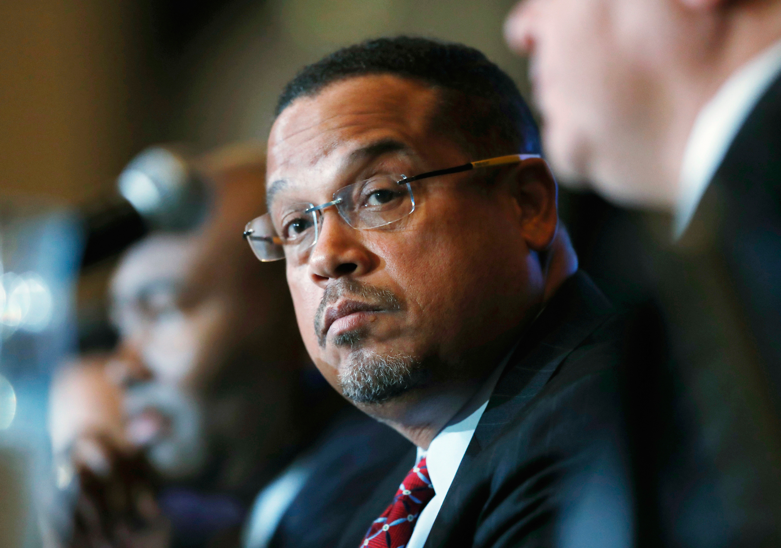 FILE - In this Dec. 2, 2016 file photo, U.S. Rep. Keith Ellison, D-Minn., listens during a forum on the future of the Democratic Party, in Denver. Ellison, who is currently running to be the next chair of the Democratic National Committee, announced Mond