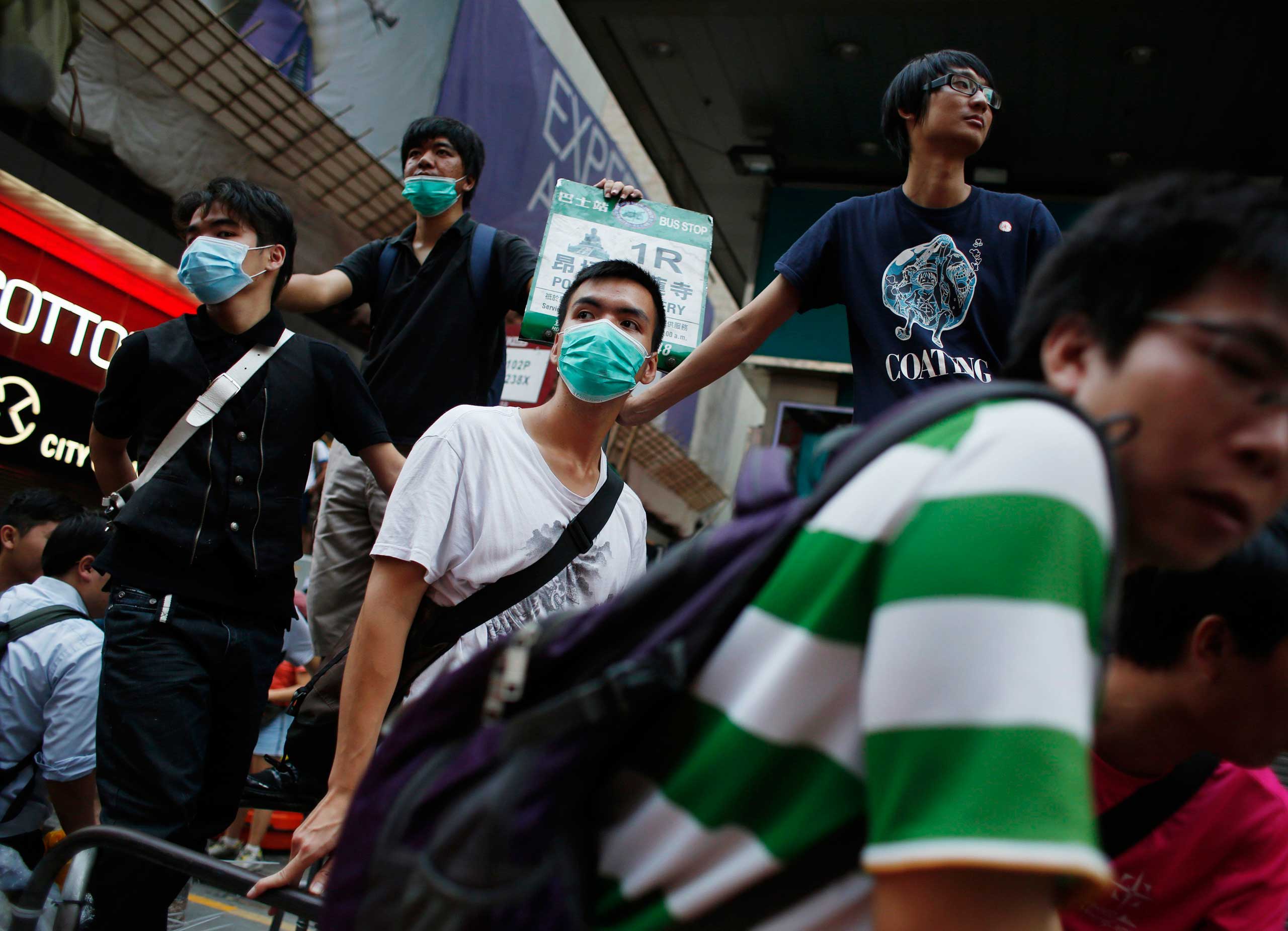 Pro-democracy protesters man a barricade in Hong Kong's Mongkok shopping district