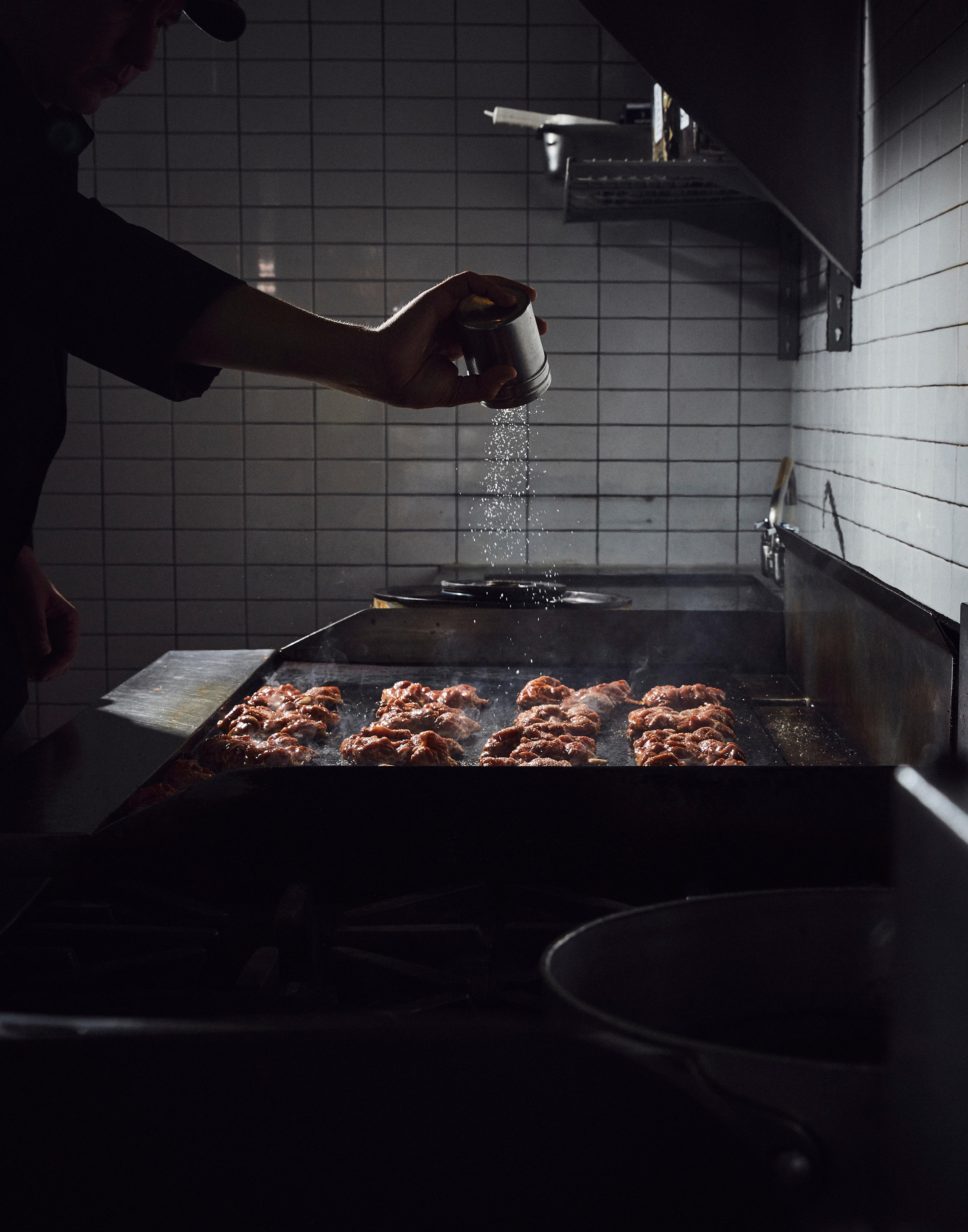 A Chipotle employee seasons chicken at a location in Newport Beach, Calif. Restaurants aren't as busy as they once were, but the company is on track to open roughly 150 new locations in 2019.