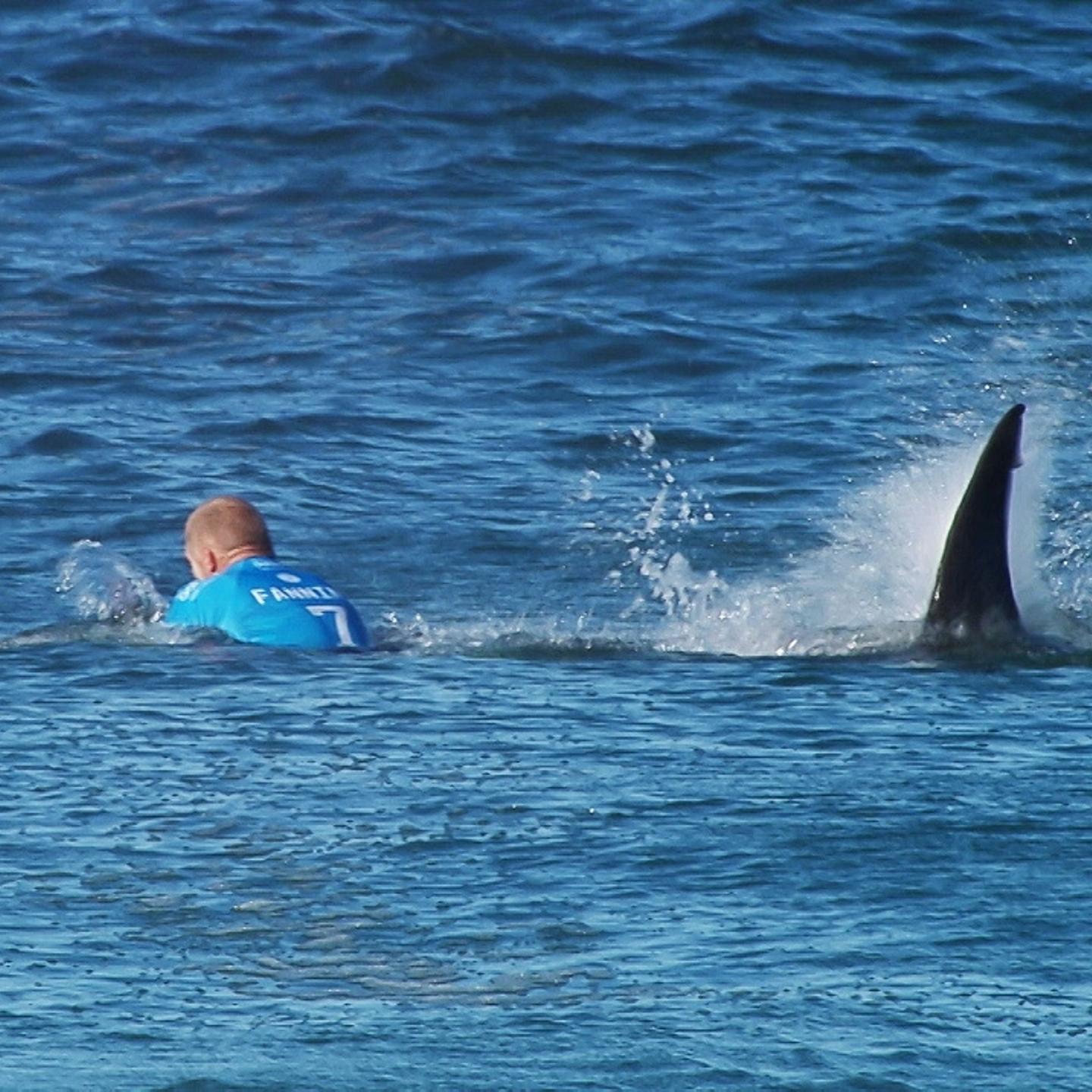 Australian surfer Mick Flanning is pursued by a shark, in Jeffrey's Bay, South Africa on July 19, 2015.