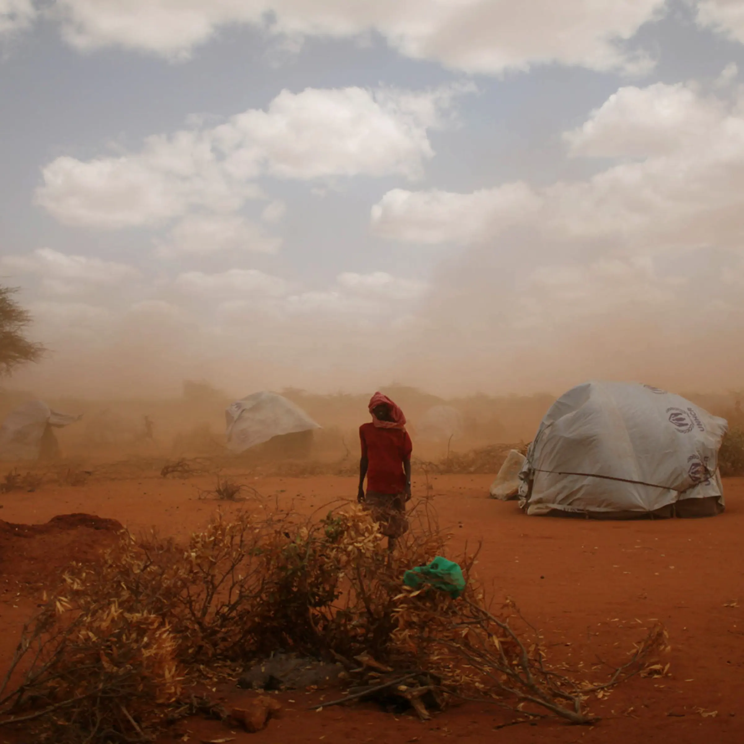 A sandstorm blows through Ifo Camp where new arrivals live. 30,000 people are estimated to have arrived at the camp in June, a steep climb from the average of 5,000 last year. Dadaab, Eastern Kenya, July 18, 2011.