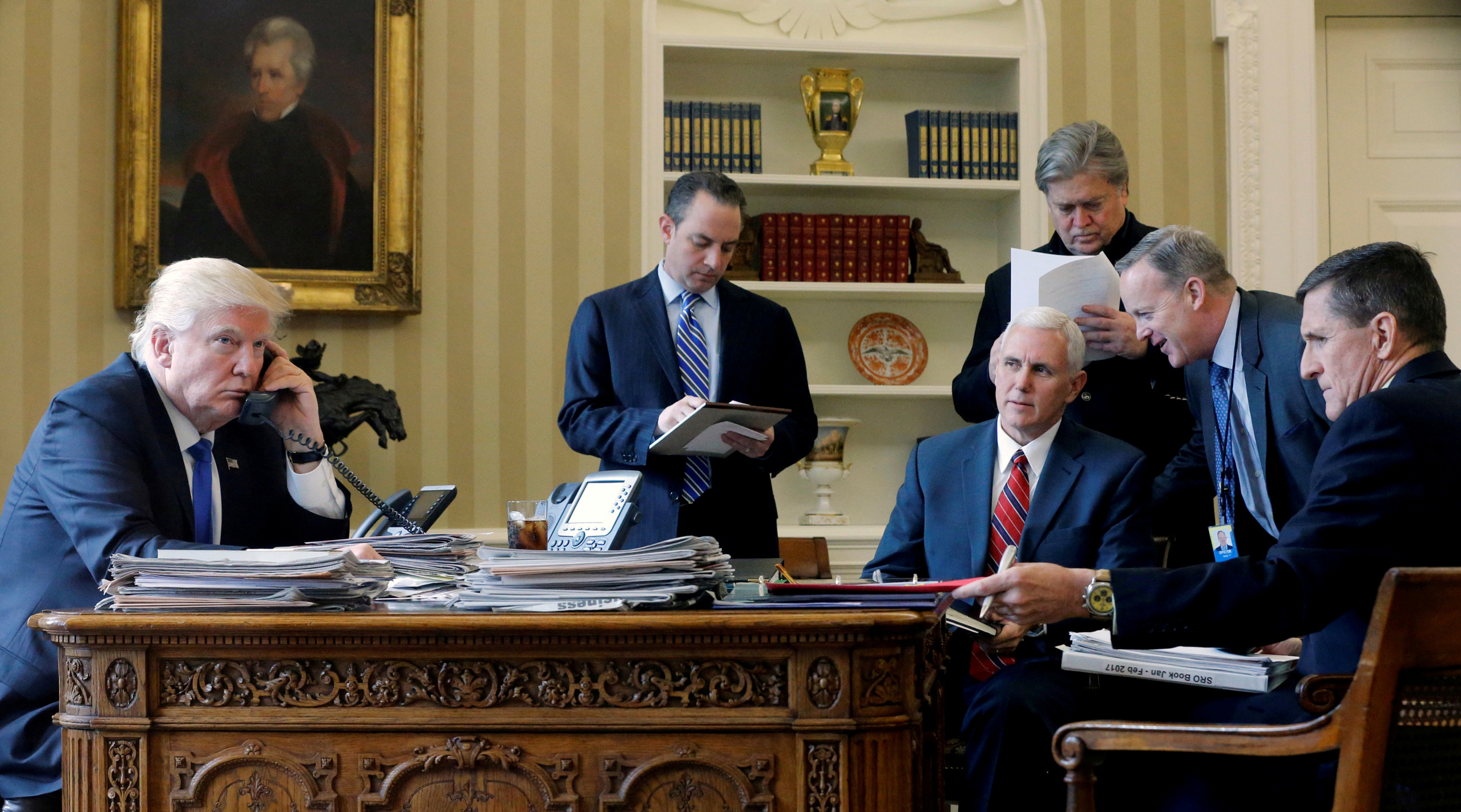 FILE PHOTO: U.S. President Donald Trump (L-R), joined by Chief of Staff Reince Priebus, Vice President Mike Pence, senior advisor Steve Bannon, Communications Director Sean Spicer and National Security Advisor Michael Flynn, speaks by phone with Russia's