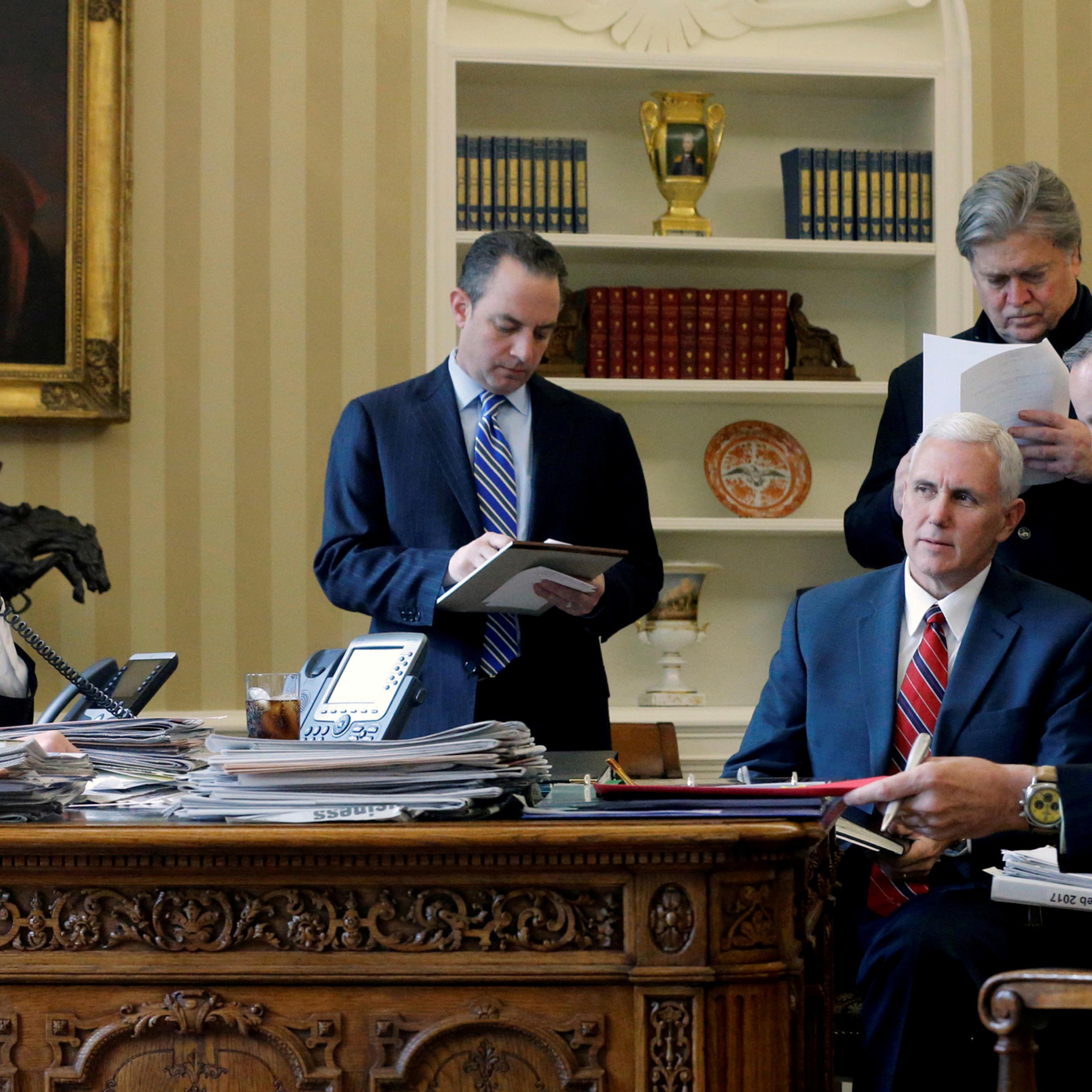 FILE PHOTO: U.S. President Donald Trump (L-R), joined by Chief of Staff Reince Priebus, Vice President Mike Pence, senior advisor Steve Bannon, Communications Director Sean Spicer and National Security Advisor Michael Flynn, speaks by phone with Russia's