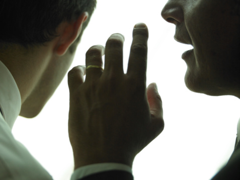 businessmen-gossip-whispering