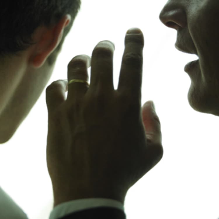 businessmen-gossip-whispering