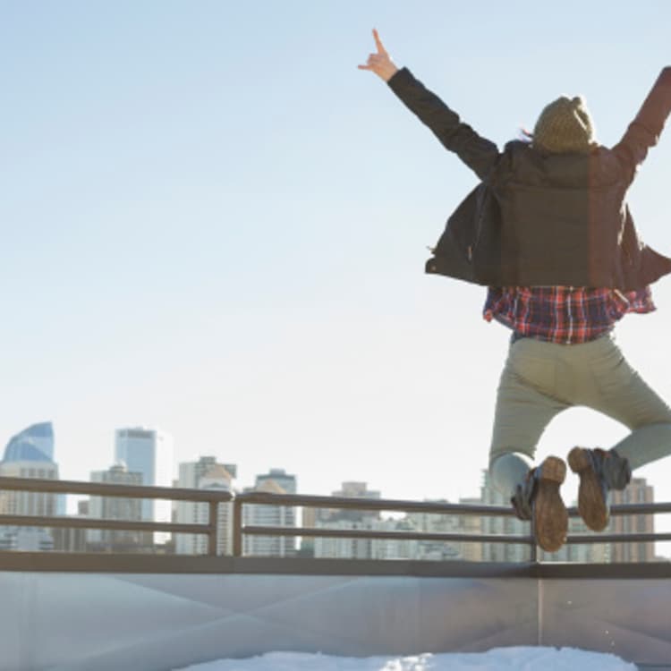 person-jumping-building-top