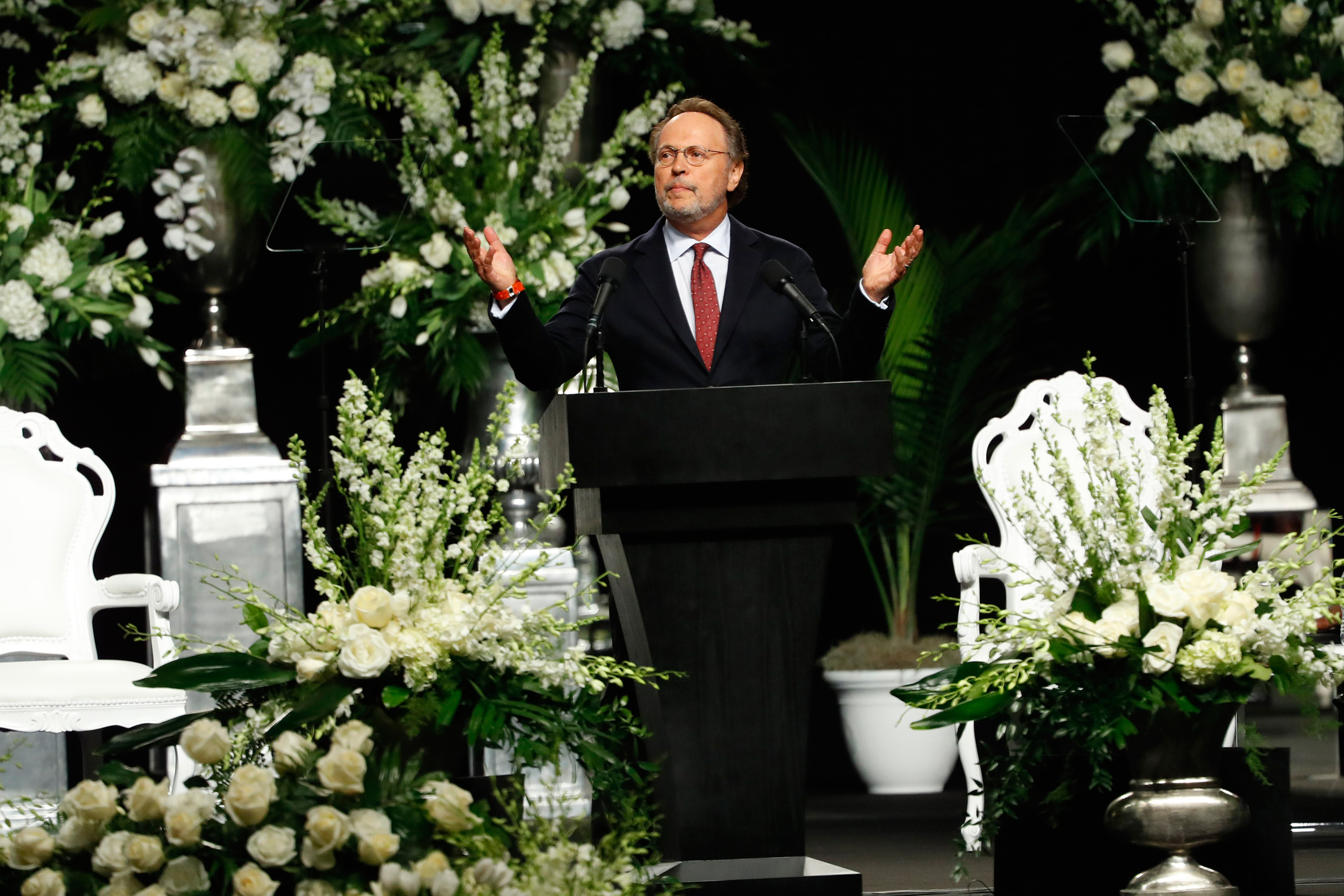 LOUISVILLE, KY - JUNE 10: Billy Crystal speaks during a memorial service for boxing legend Muhammad Ali on June 10, 2016 at the KFC Yum! Center in Louisville, Kentucky. Ali died June 3 of complications from Parkinson's disease. (Photo by Aaron P. Bernste