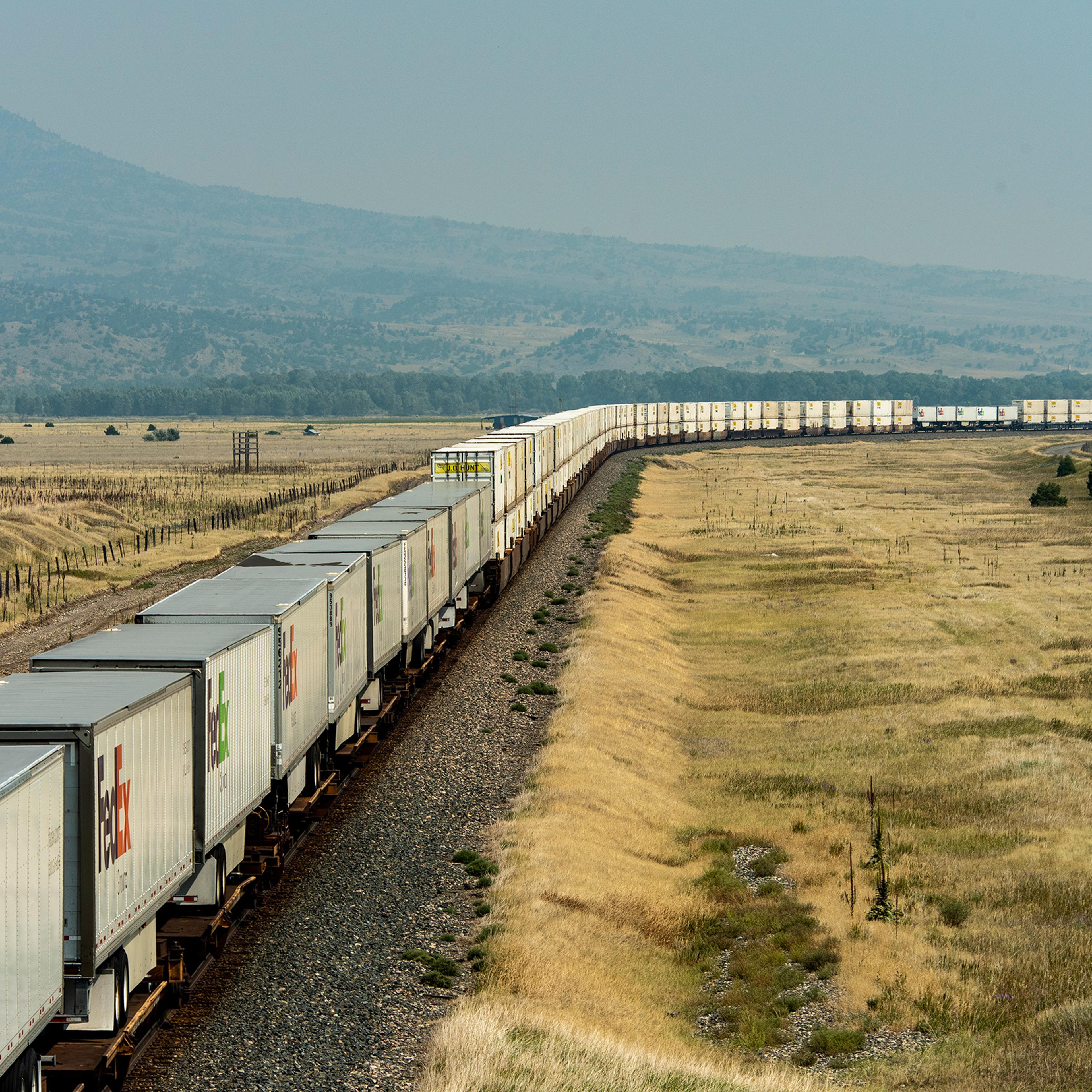 A BNSF freight train with 76 container cars and FedEx freight trailers travels from Seattle to points east on August 23, 2021 in Livingston, Mont.