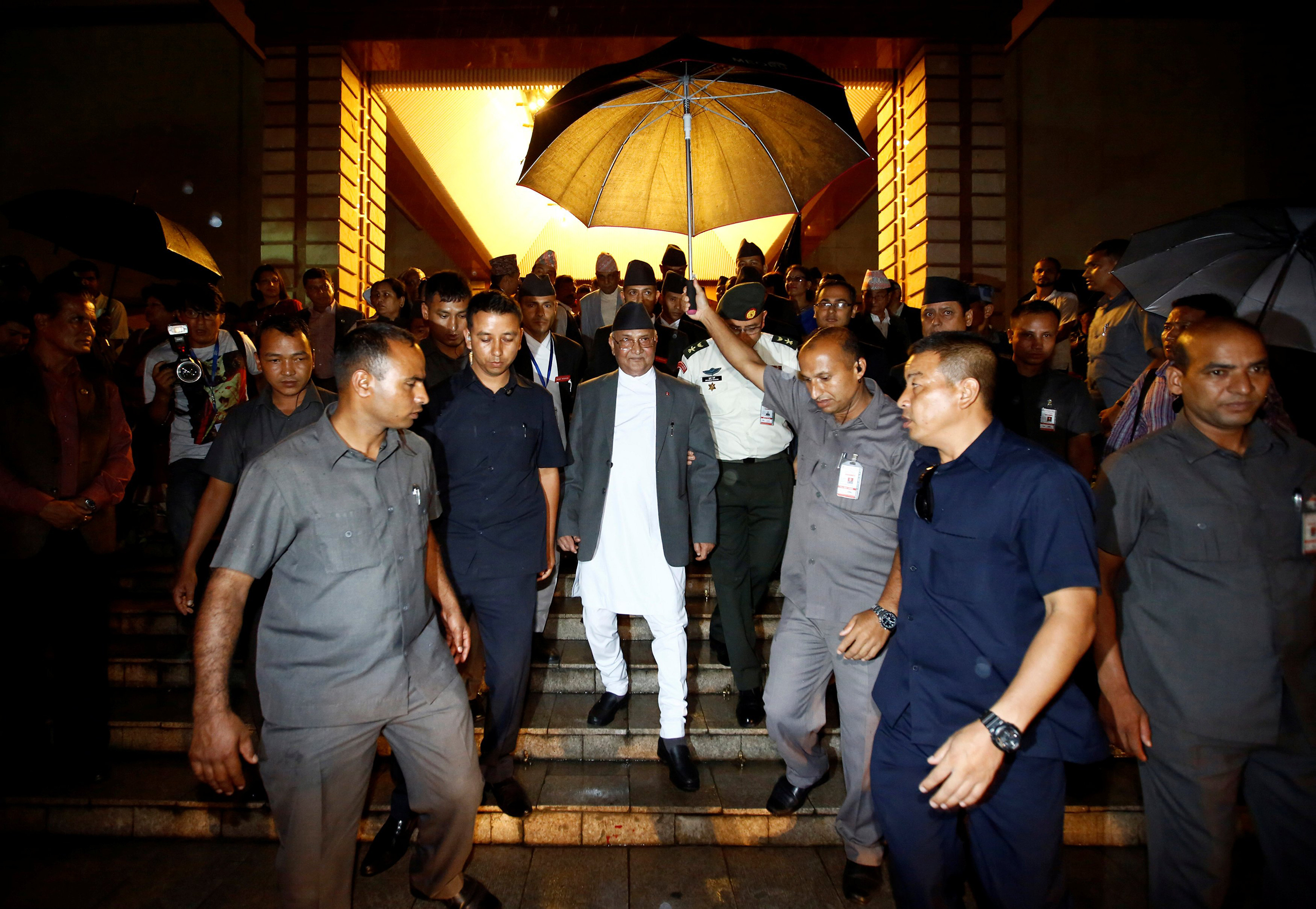 Nepal's Prime Minister Khadga Prasad Sharma Oli, also known as KP Oli, walks out from the parliament after announcing his resignation in Kathmandu, Nepal, July 24, 2016.