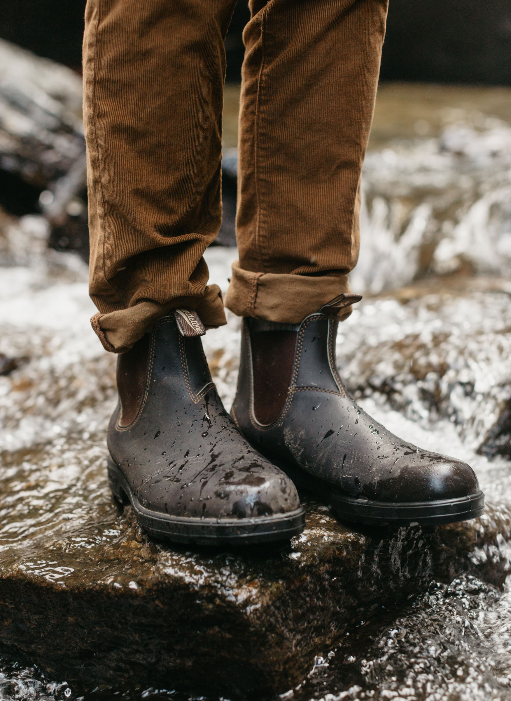 a person wearing Blundstone boots