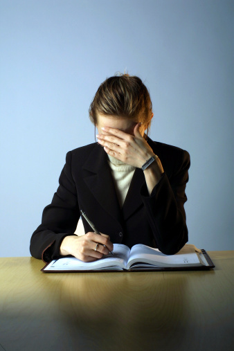 stressed-businesswoman-desk
