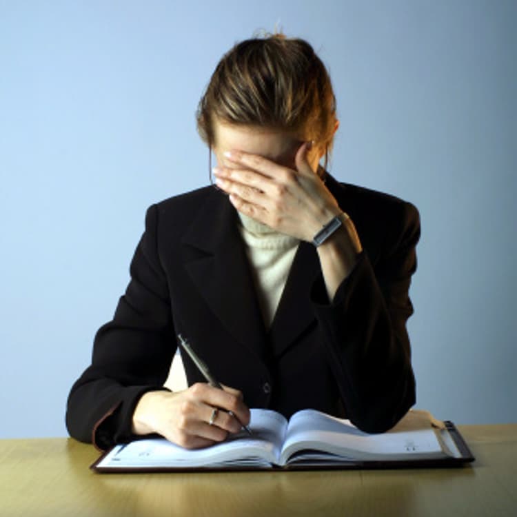 stressed-businesswoman-desk