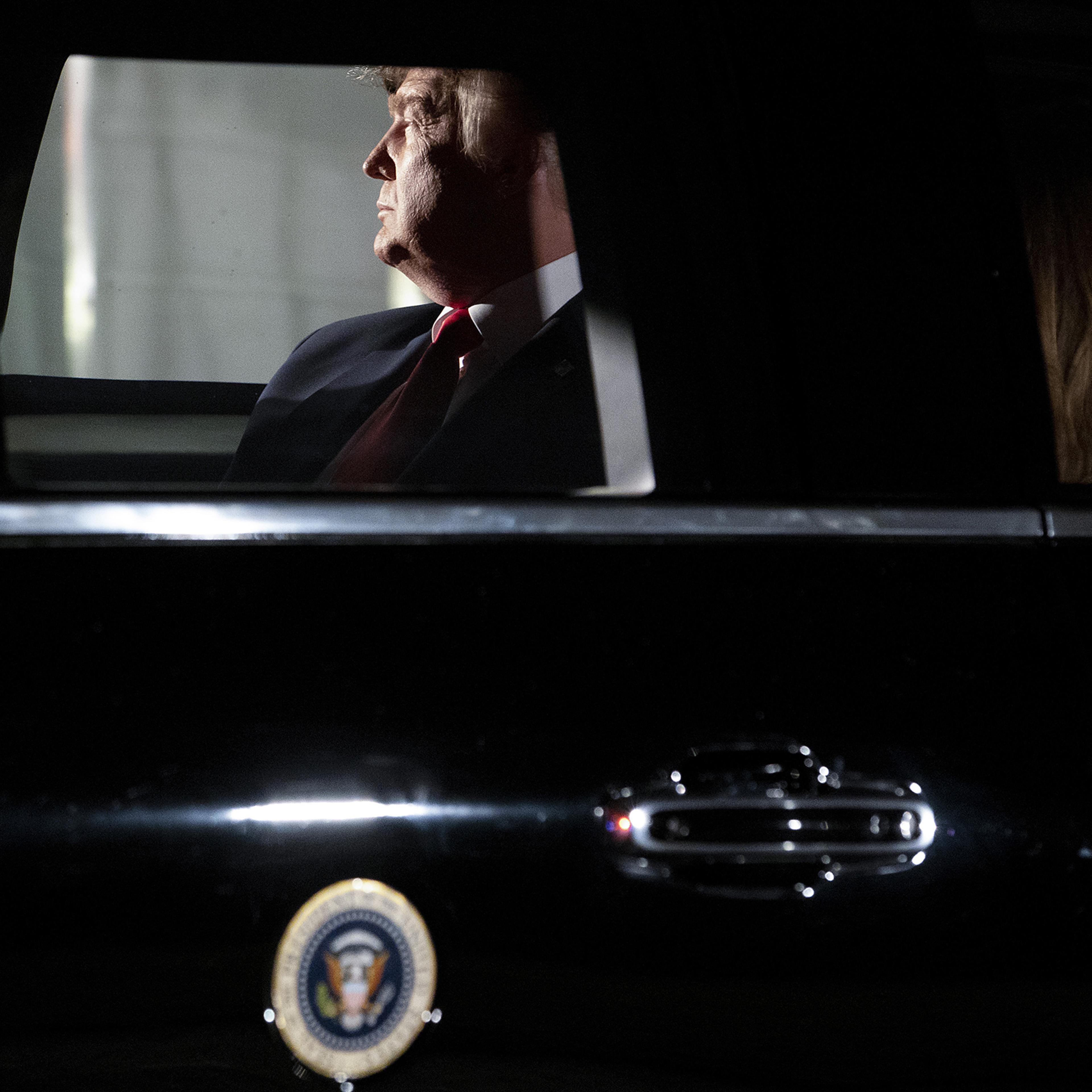 President Donald Trump sits in the presidential motorcade