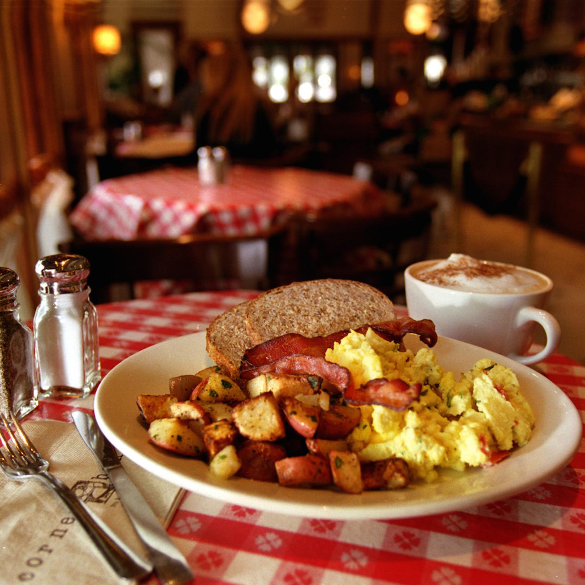 Breakfast combo country potatoes, cheesey scramble eggs and applewood smoked Bacon served with har