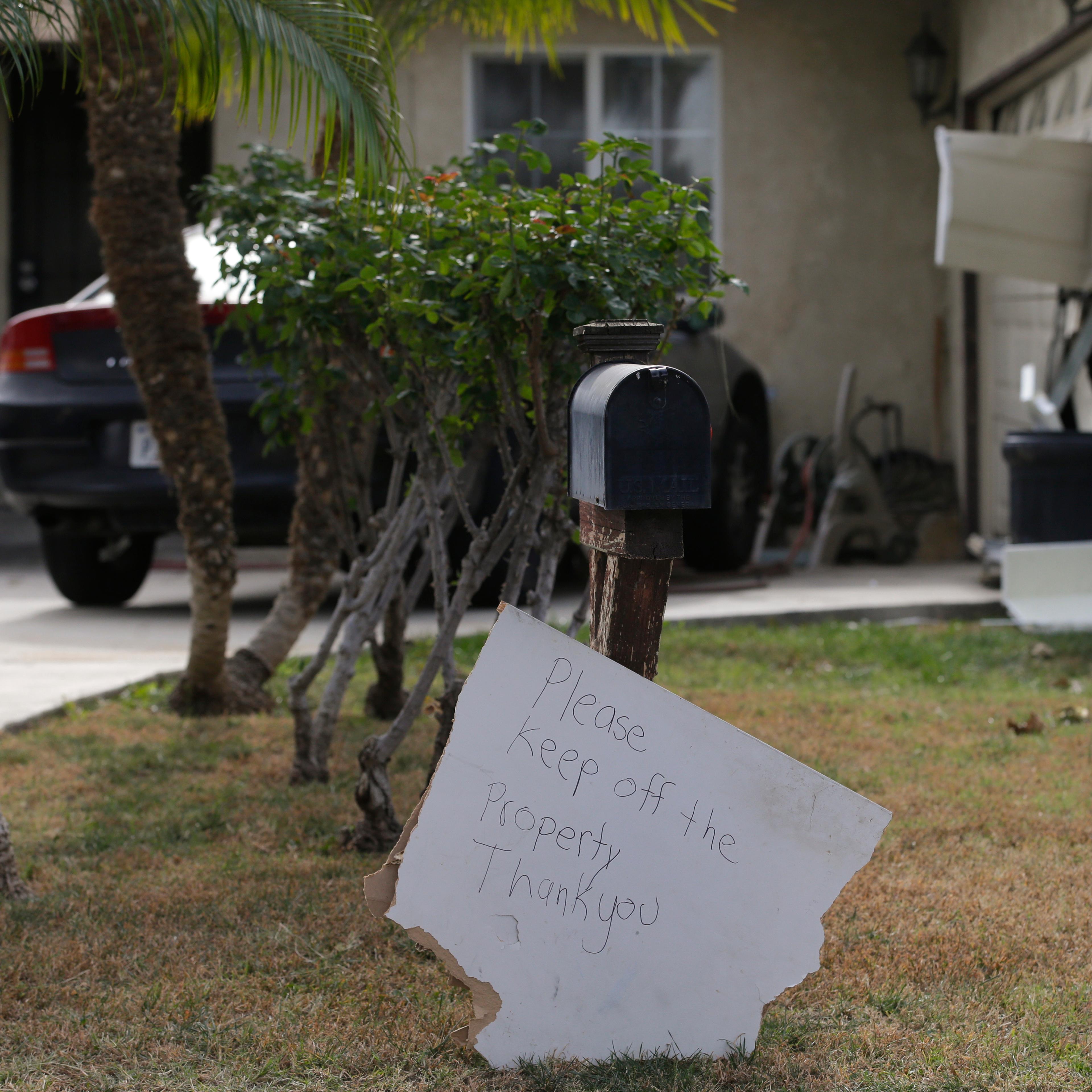 A sign stands in front of a mailbox at Enrique Marquez's home in Riverside, Calif. on Dec. 9, 2015.