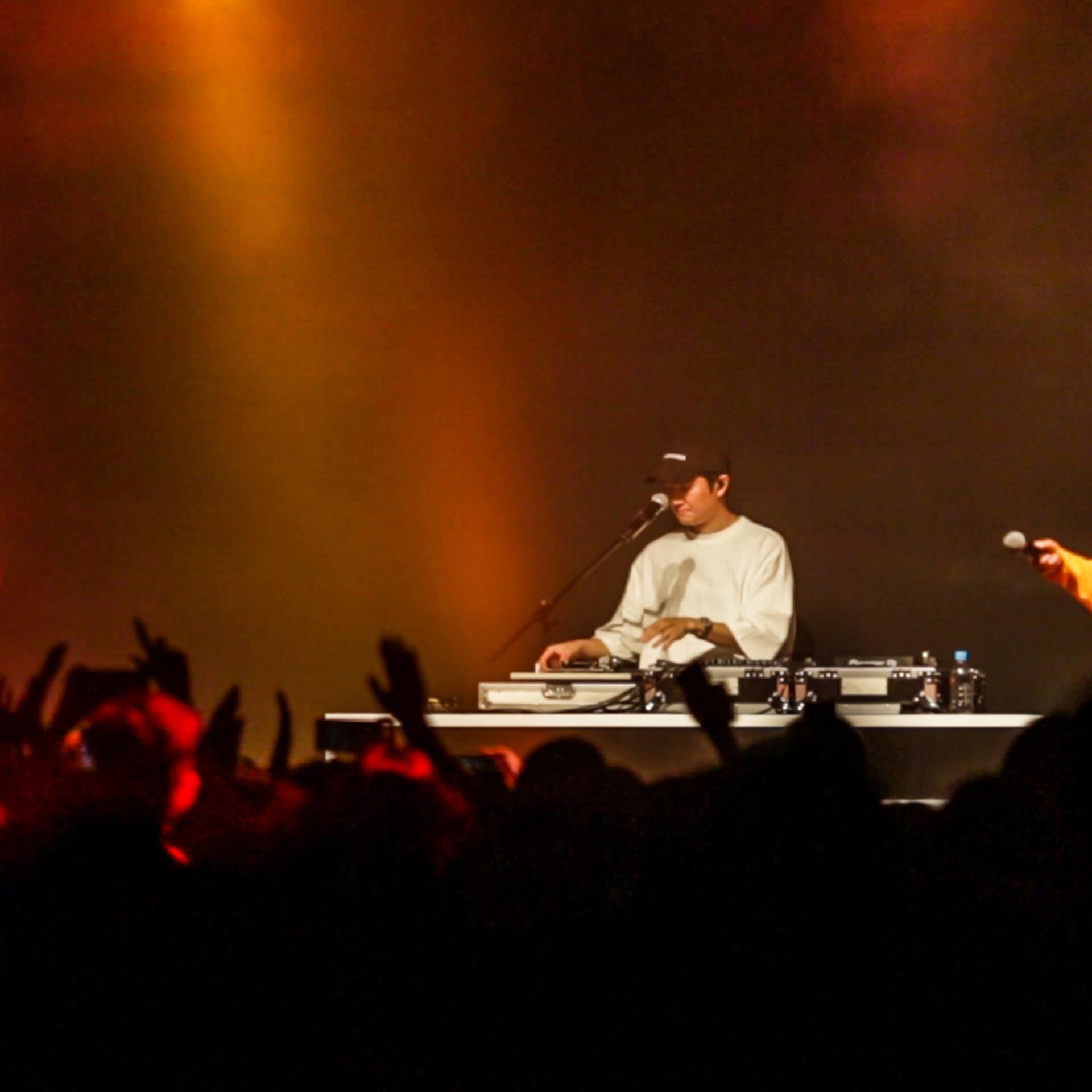 Video screenshot of South Korean hip-hop group Epik High's concert at Kowloon Bay International Trade & Exhibition Centre in Hong Kong on June 27, 2019 (left to right: Mithra Jin, DJ Tukutz, Tablo).