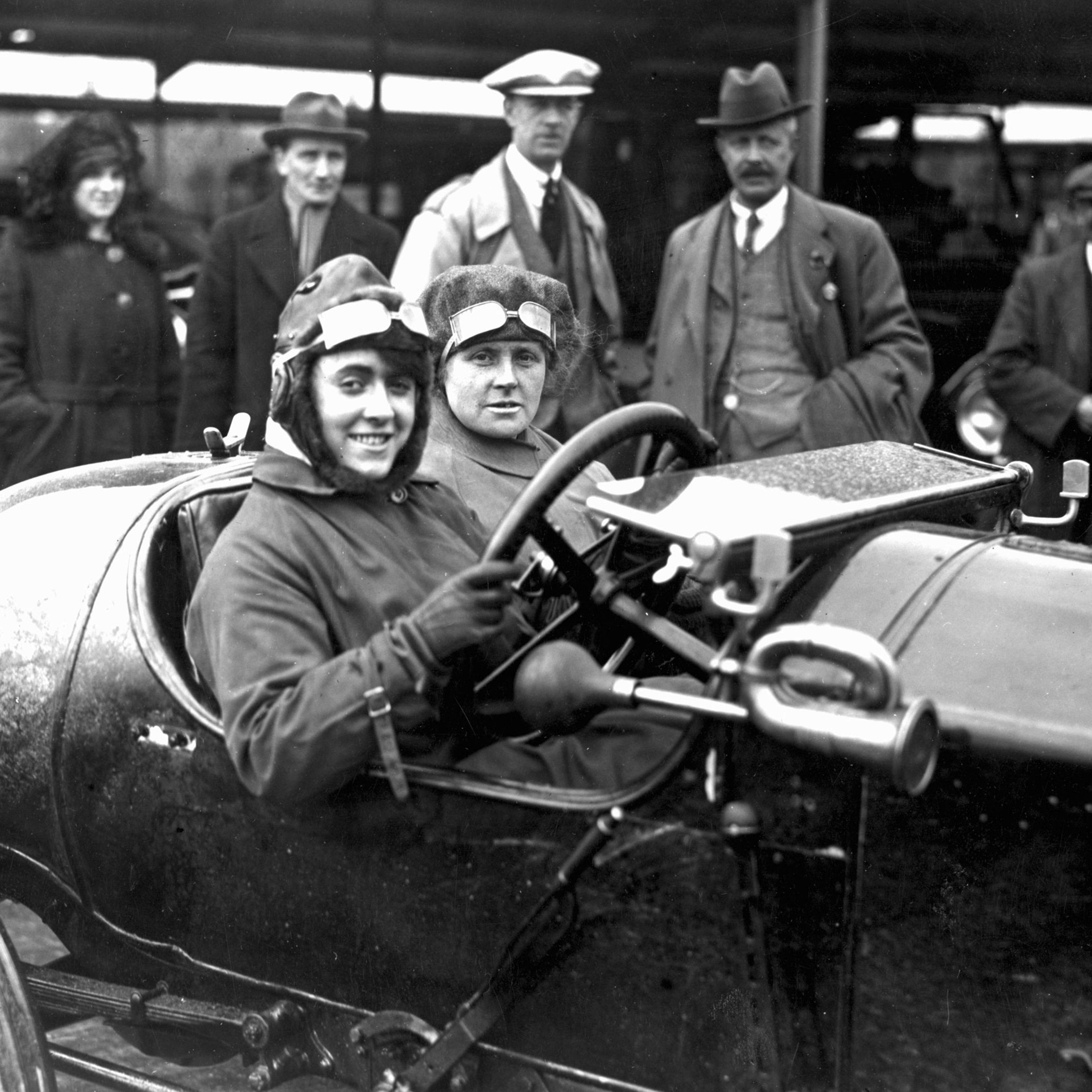 Motor meeting at Brooklands, Weybridge, Surrey. Competitor Ivy Cummings and her mother in their racing car. April 1920.