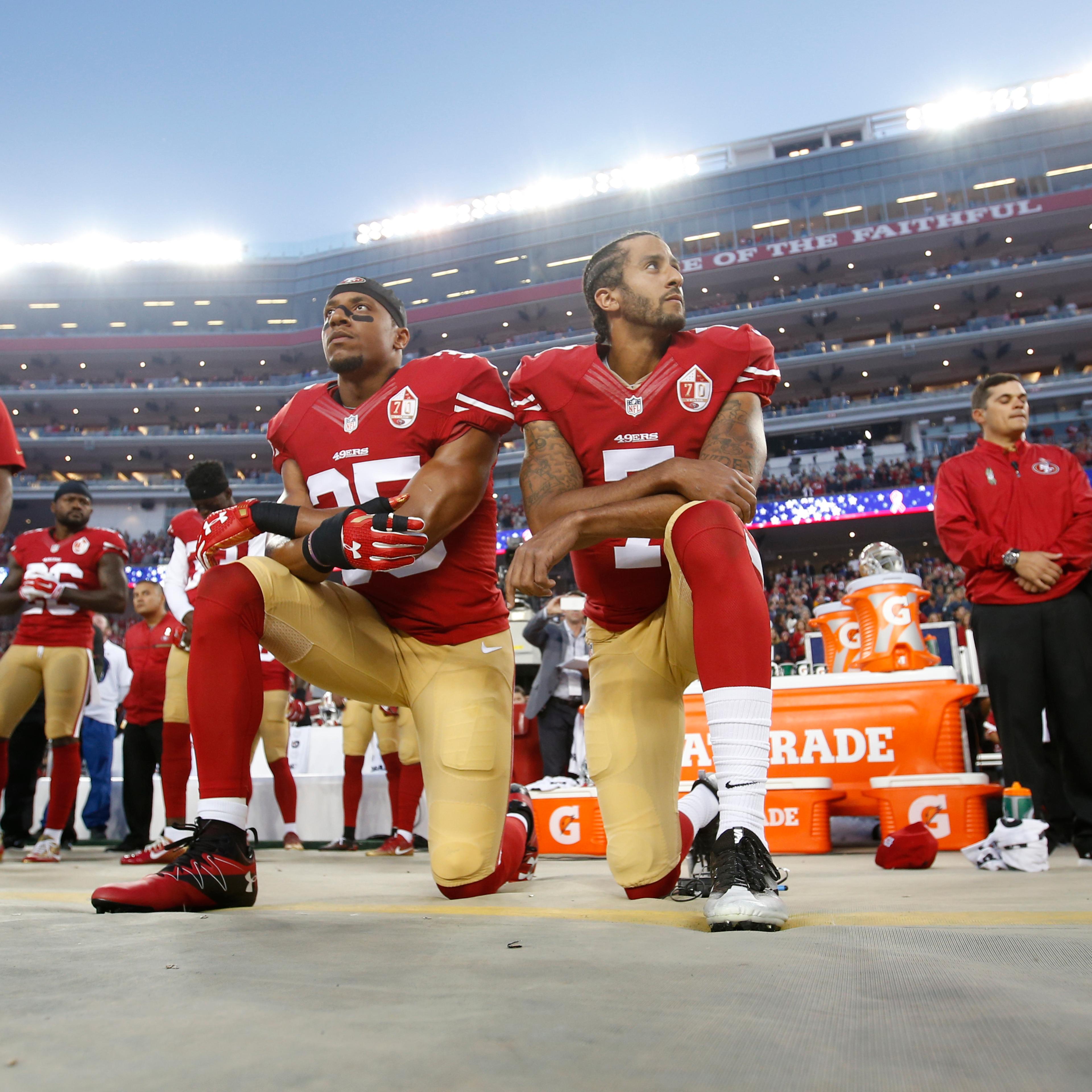 Eric Reid #35 and Colin Kaepernick #7 of the San Francisco 49ers kneel during the anthem, prior to the game against the Los Angeles Rams at Levi Stadium in Santa Clara, Calif., on Sept. 12, 2016.