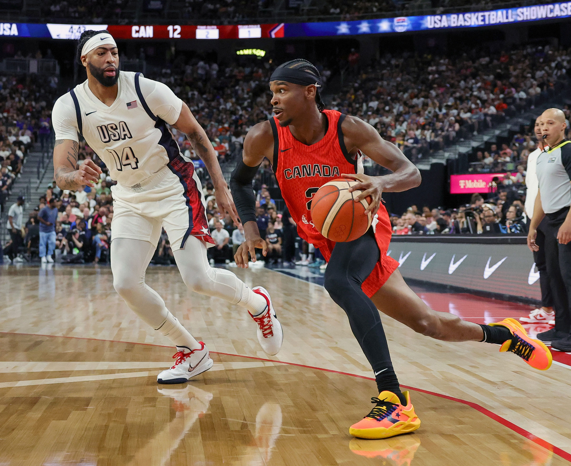 Canada star Shai Gilgeous-Alexander drives against Anthony Davis